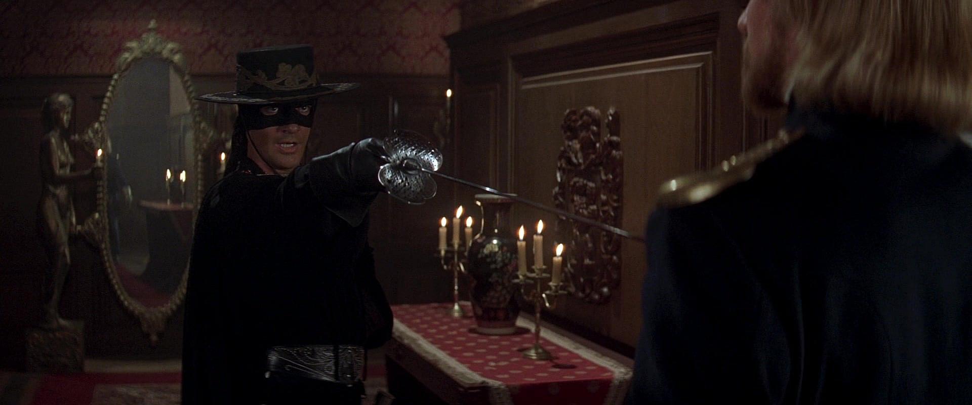 Zorro questions Don Rafael Montero at sword point in The Mask of Zorro (1998), Sony Pictures