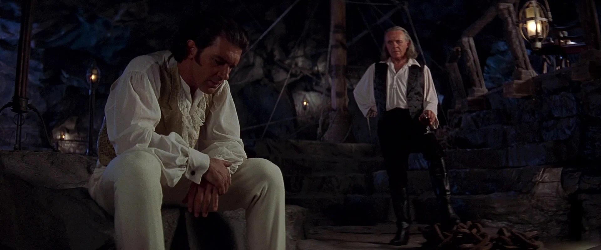 Don Diego de la Vega chastises Alejandro Murrieta for soiling Zorro's name in The Mask of Zorro