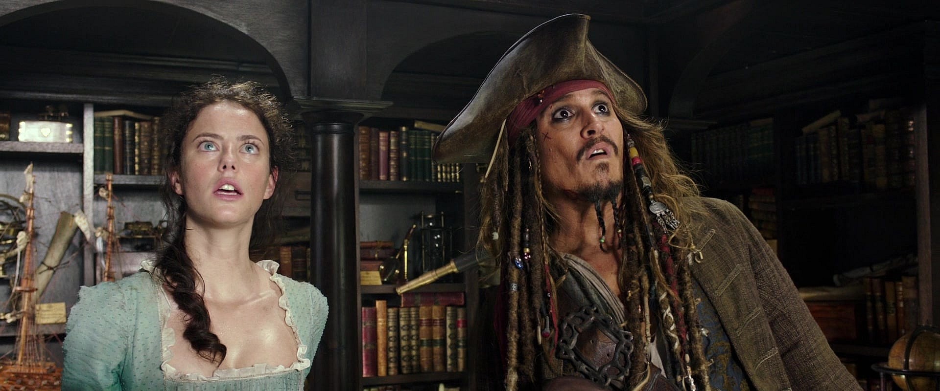 Carina Smyth Barbossa (Kaya Scodelario) and Captain Jack Sparrow (Johnny Depp) attempt to run from the authorities in Pirates of the Caribbean: Dead Men Tell No Tales (2011), Disney