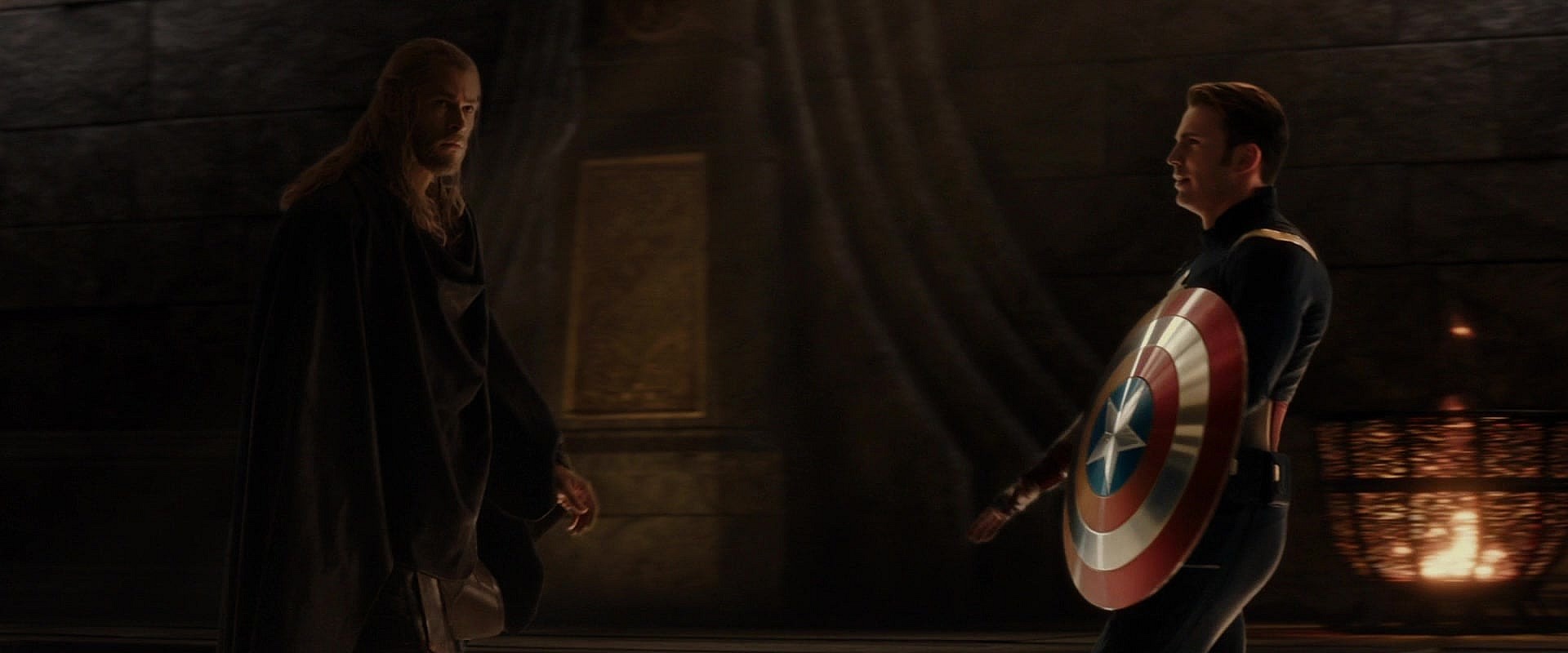 Loki (Tom Hiddleston) takes on the form of Captain America (Chris Evans) to taunt Thor (Chris Hemsworth) in Thor: The Dark World (2015), Marvel Entertainment