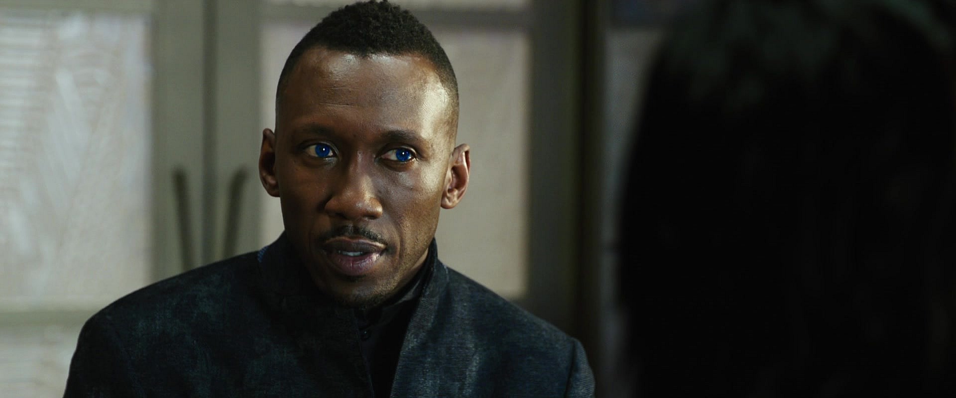 Vector (Mahershala Ali) has an offer for Alita (Rosa Salazar) in Alita: Battle Angel (2019), 20th Century Fox