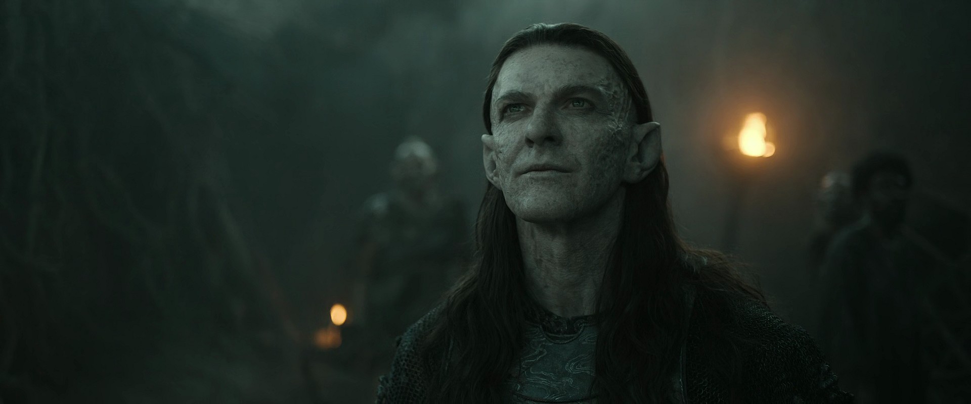 Adar (Joseph Mawle) speaks with the troll Damrod (Benjamin Walker) in The Lord of The Rings: The Rings of Power Season 2 Episode 3 " The Eagle and The Sceptre" (2024), Amazon Prime