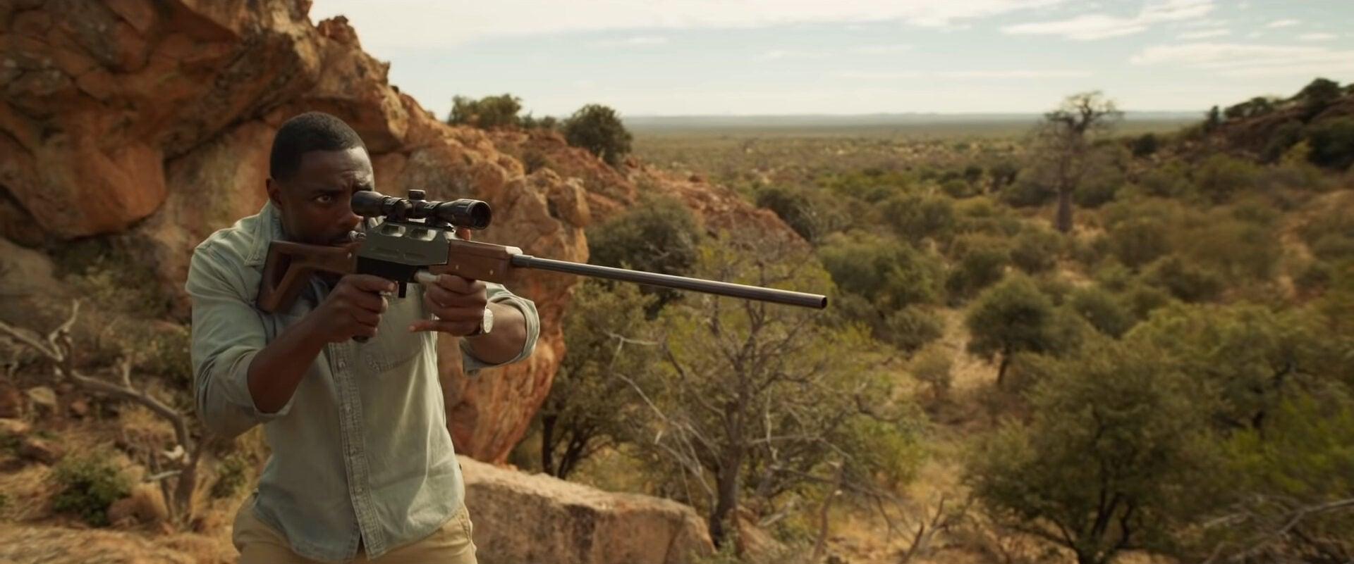 Dr. Nate Samuels (Idris Elba) readies his rifle in Beast (2022), Universal Pictures