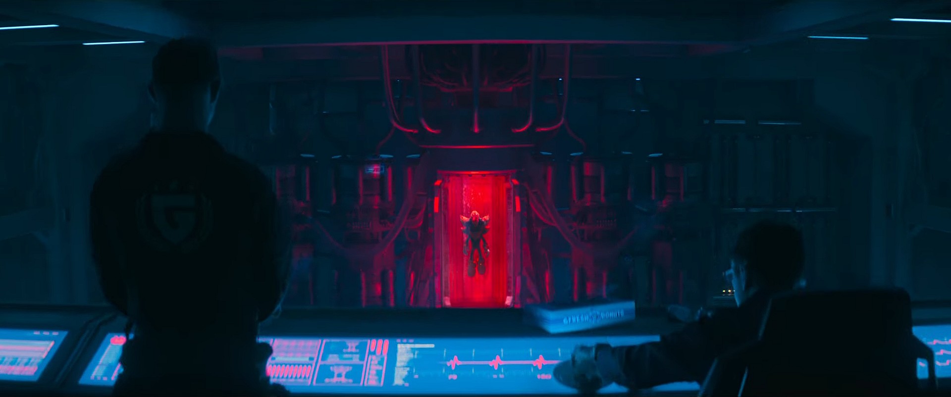 Shadow (Keanu Reeves) suspended in a tube while GUN soldiers look on in Sonic the Hedgehog 3 (2024), Paramount Pictures