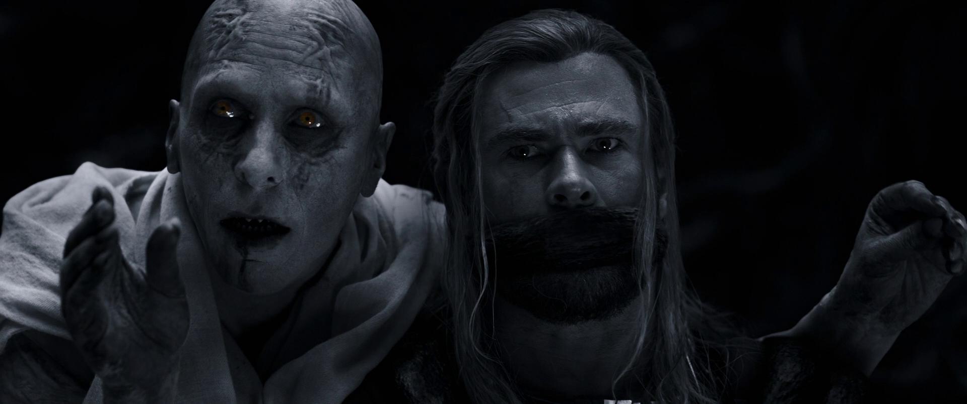 Gorr (Christian Bale) has Thor (Chris Hemsworth) in his clutches in Thor: Love and Thunder (2022), Marvel Entertainment