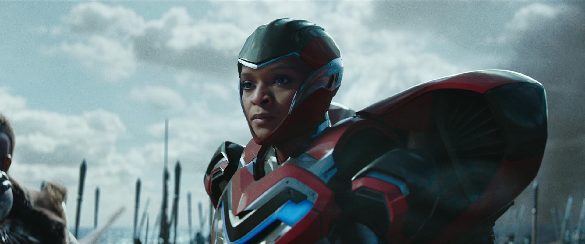 Riri Williams (Dominique Thorne) listens as Shuri (Letitia Wright) declares victory in Black