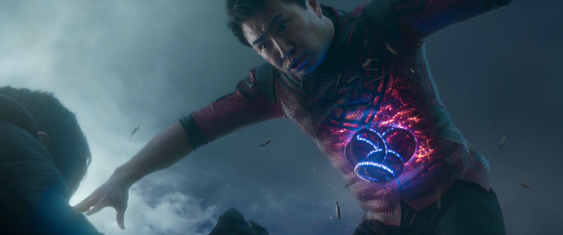 Shang-Chi (Simu Liu) feels the full force of Wenwu's control over the Marvel Cinematic Universe's version of the Ten Rings in Shang-Chi and the Legend of the Ten Rings (2021), Marvel Entertainment via Blu-Ray