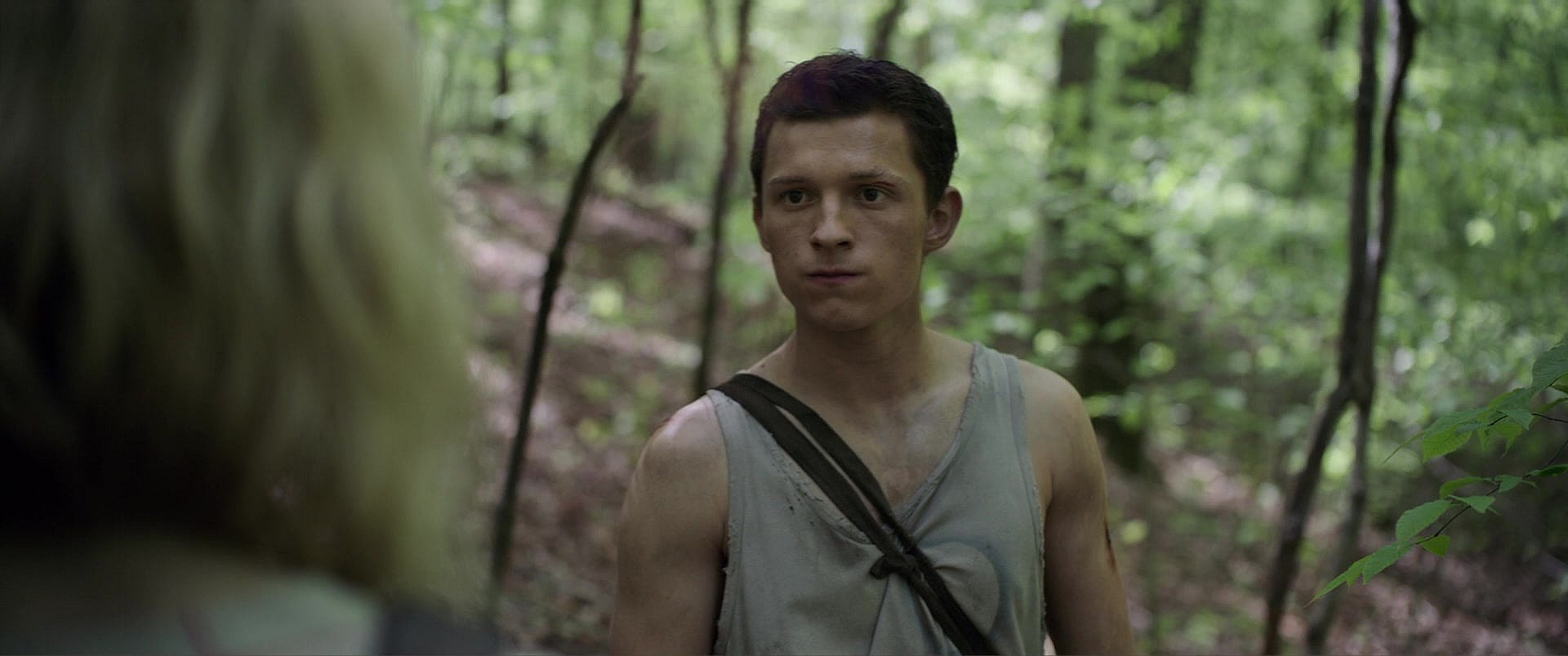 Todd Hewitt (Tom Holland) and Vviola Eade (Daisy Ridley) talk about their pasts in Chaos Walking (2021), Lionsgate