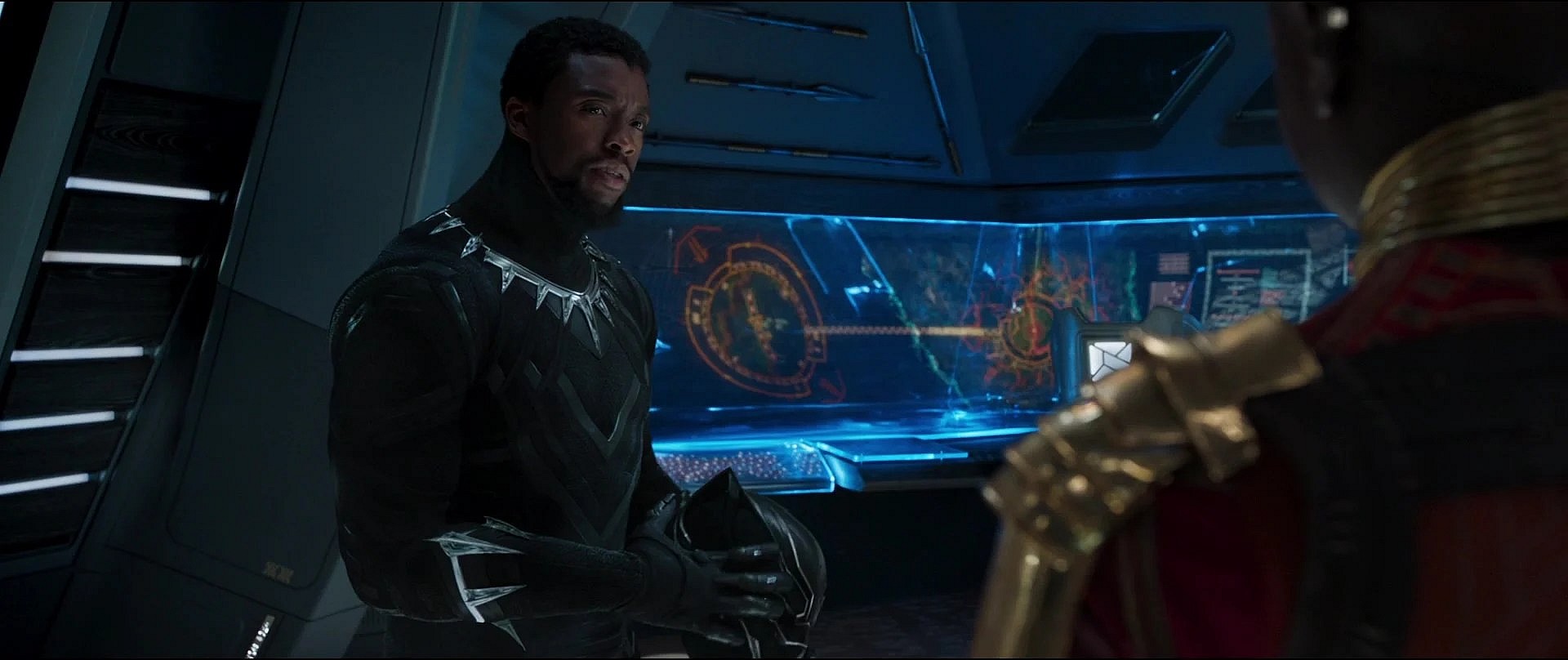 T'Challa (Chadwick Boseman) strategizes with Okoye (Danai Gurira) in Black Panther (2019)