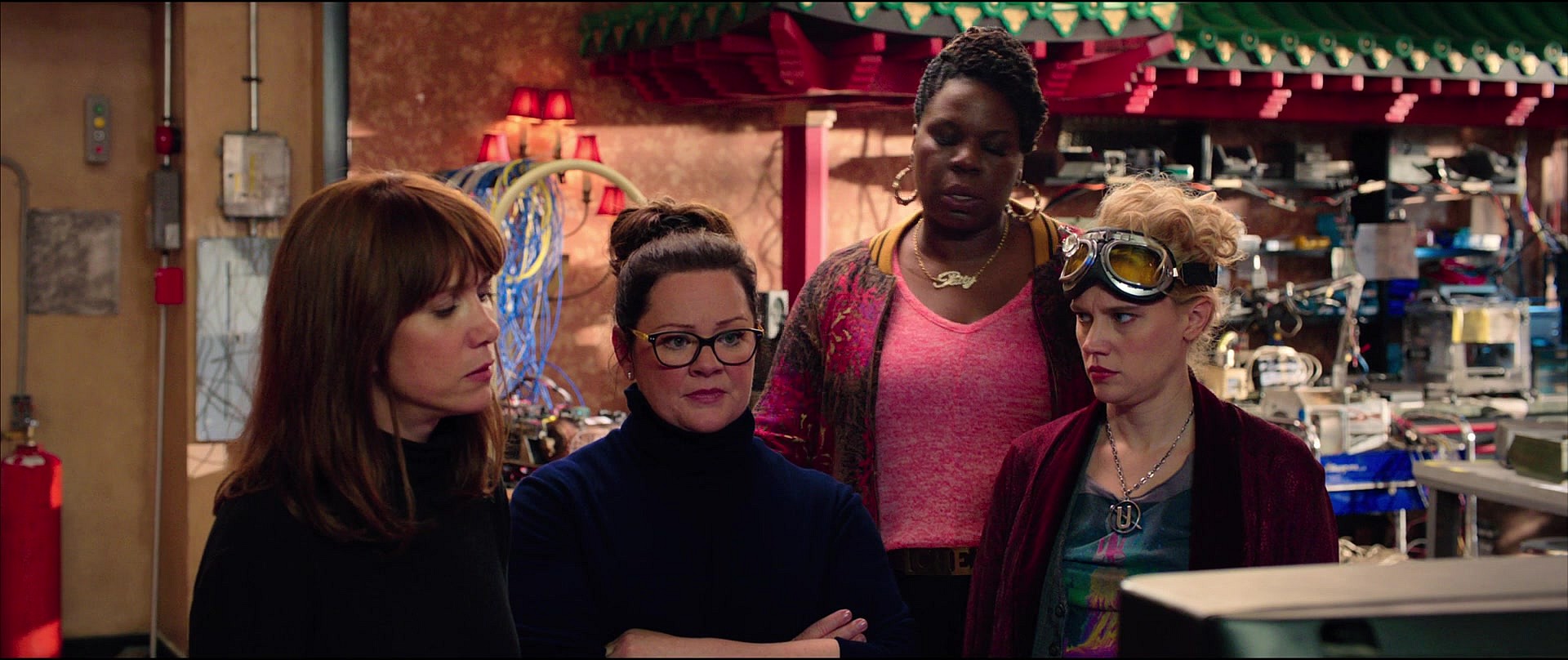 Erin Gilbert (Kristen Wiig), Jillian Holtzmann (Kate McKinnon), Abby Yates (Melissa McCarthy), and Patty Tolan (Leslie Jones) find themselves faced with money troubles in Ghostbusters: Answer the Call (2016), Columbia Pictures