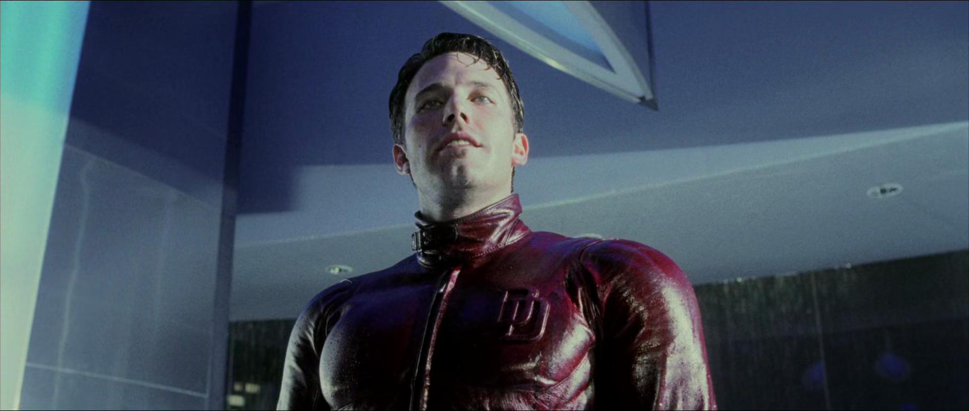Daredevil (Ben Affleck) stands tall above Kingpin (Michael Clarke Duncan) in Daredevil (2003), 20th Century Studios
