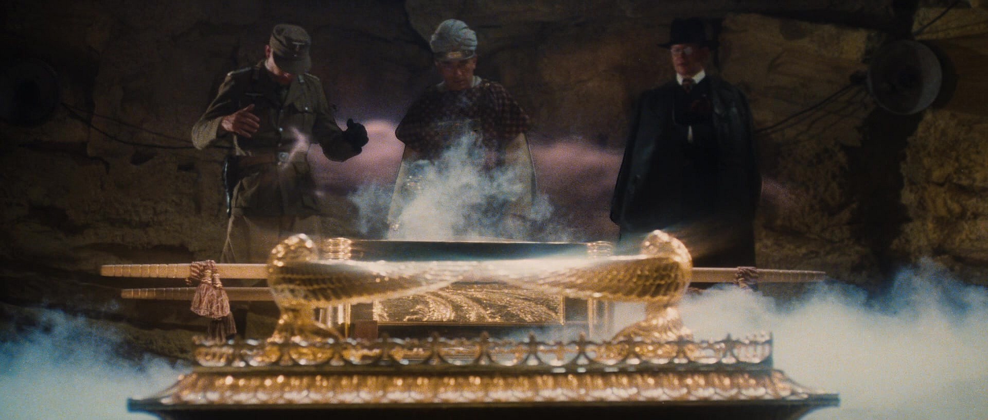 Oberst Hermann Dietrich (Wolf Kahler), René Belloq (Paul Freeman), and Major Arnold Toh (Ronald Lacey) unseal the Ark of the Covenant in 'Raiders of the Lost Ark' (1981), Paramount Pictures via Blu-ray 