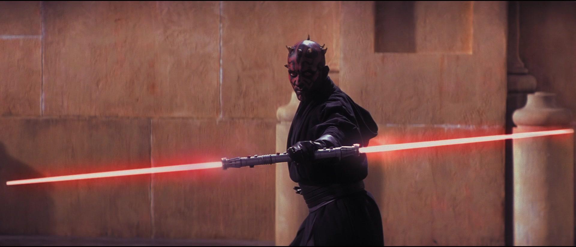 Darth Maul (Ray Park) ignites his lightsaber in Star Wars: Episode I - The Phantom Menace (1999), Lucasfilm