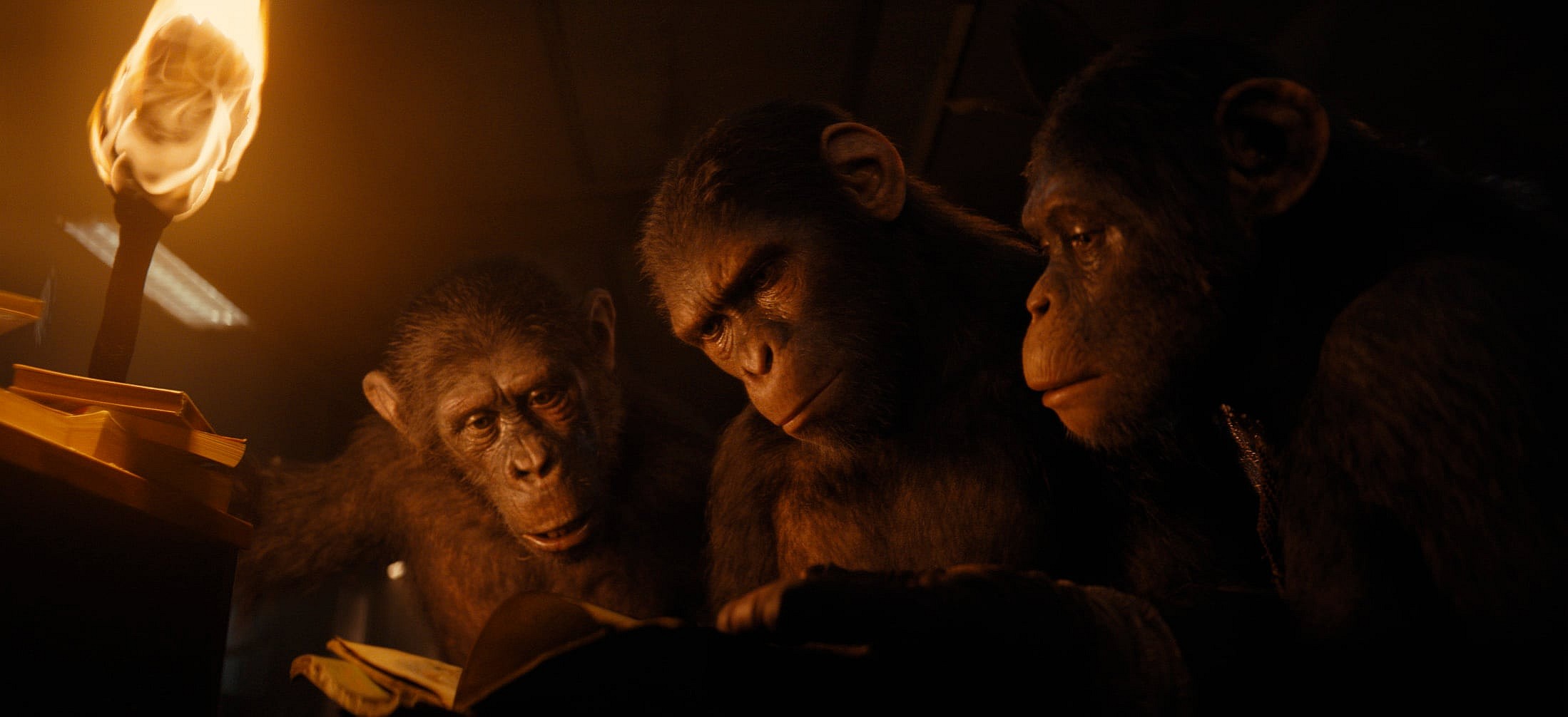 (L-R): Anaya (played by Travis Jeffery), Noa (played by Owen Teague), and Soona (played by Lydia Peckham) in 20th Century Studios' KINGDOM OF THE PLANET OF THE APES. Photo courtesy of 20th Century Studios. © 2023 20th Century Studios. All Rights Reserved.