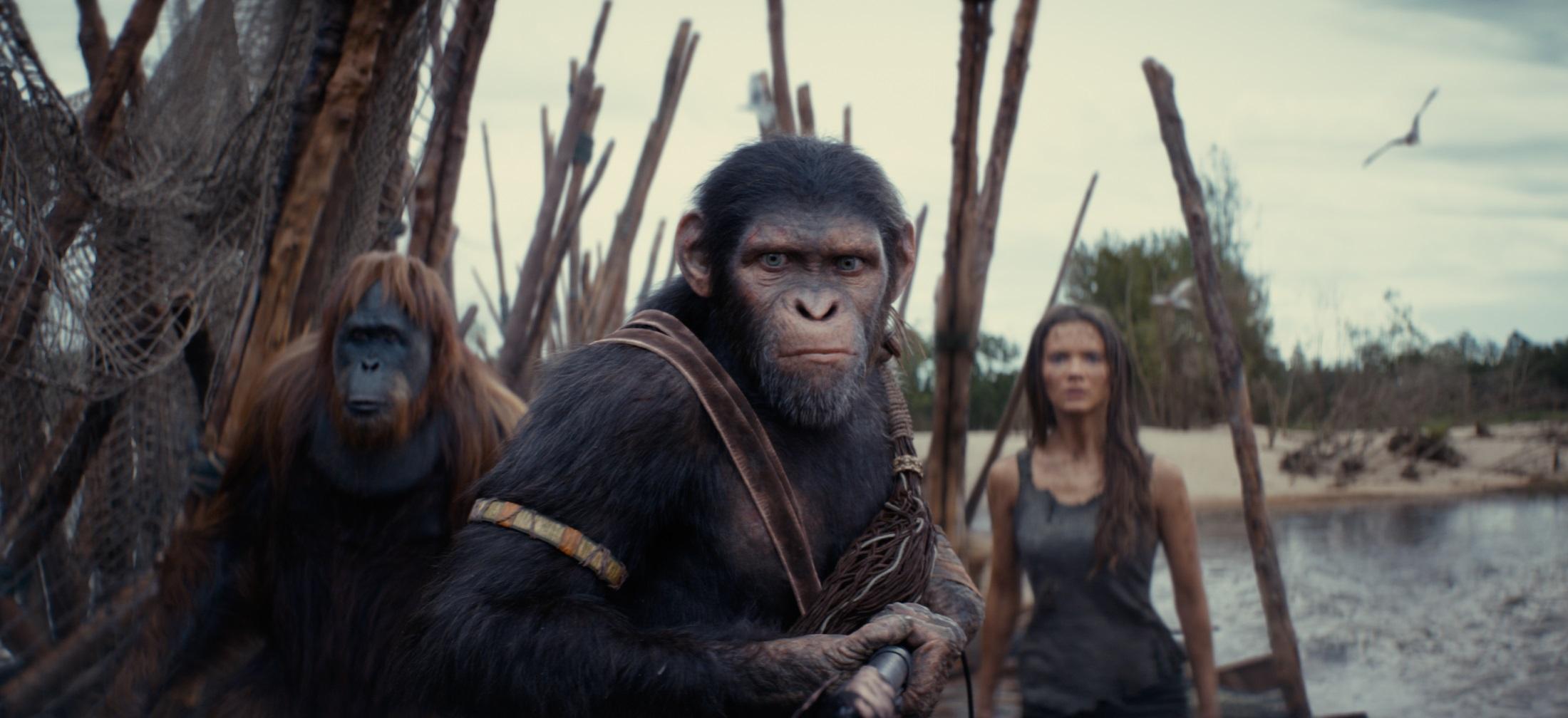 (L-R): Raka (played by Peter Macon), Noa (played by Owen Teague) , and Freya Allan as Nova in 20th Century Studios' KINGDOM OF THE PLANET OF THE APES. Photo courtesy of 20th Century Studios. © 2024 20th Century Studios. All Rights Reserved.