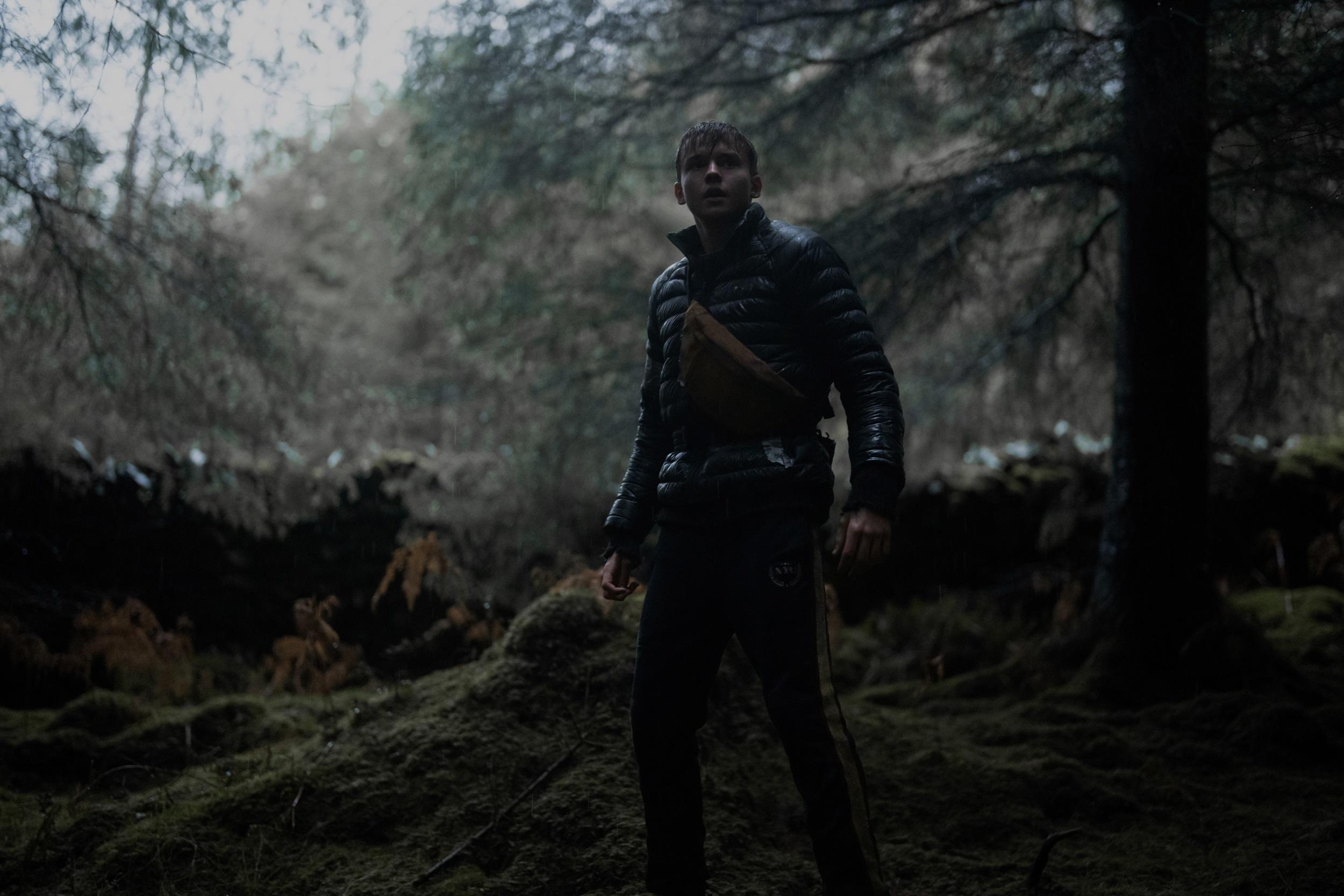 Maxwell Jenkins as Thomas in the action horror film Arcadian. Image property of RLJE Films.