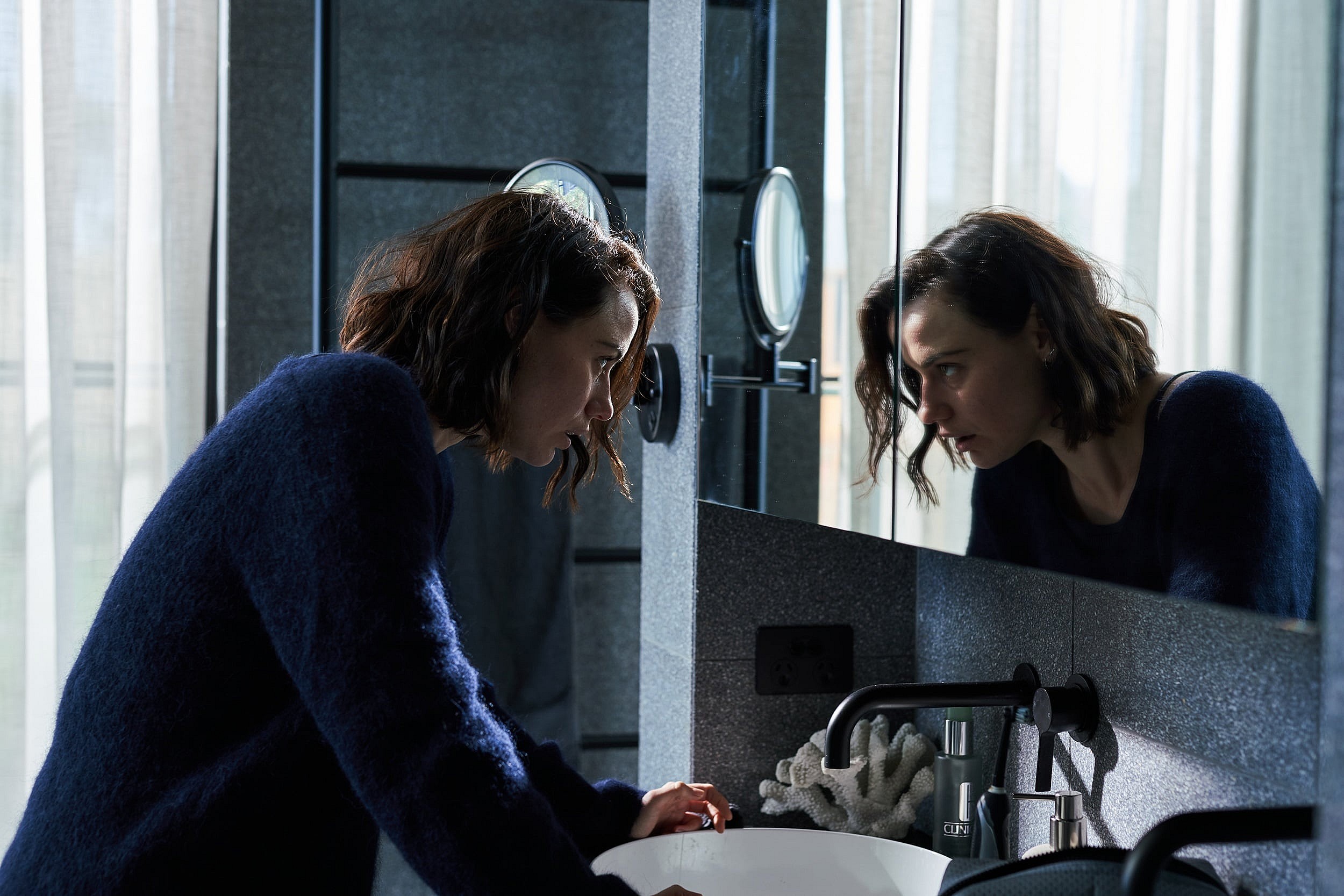 Lily Sullivan as The Interviewer in the Sci-Fi/Thriller film, MONOLITH, a Well Go USA release. Photo courtesy of Well Go USA. 