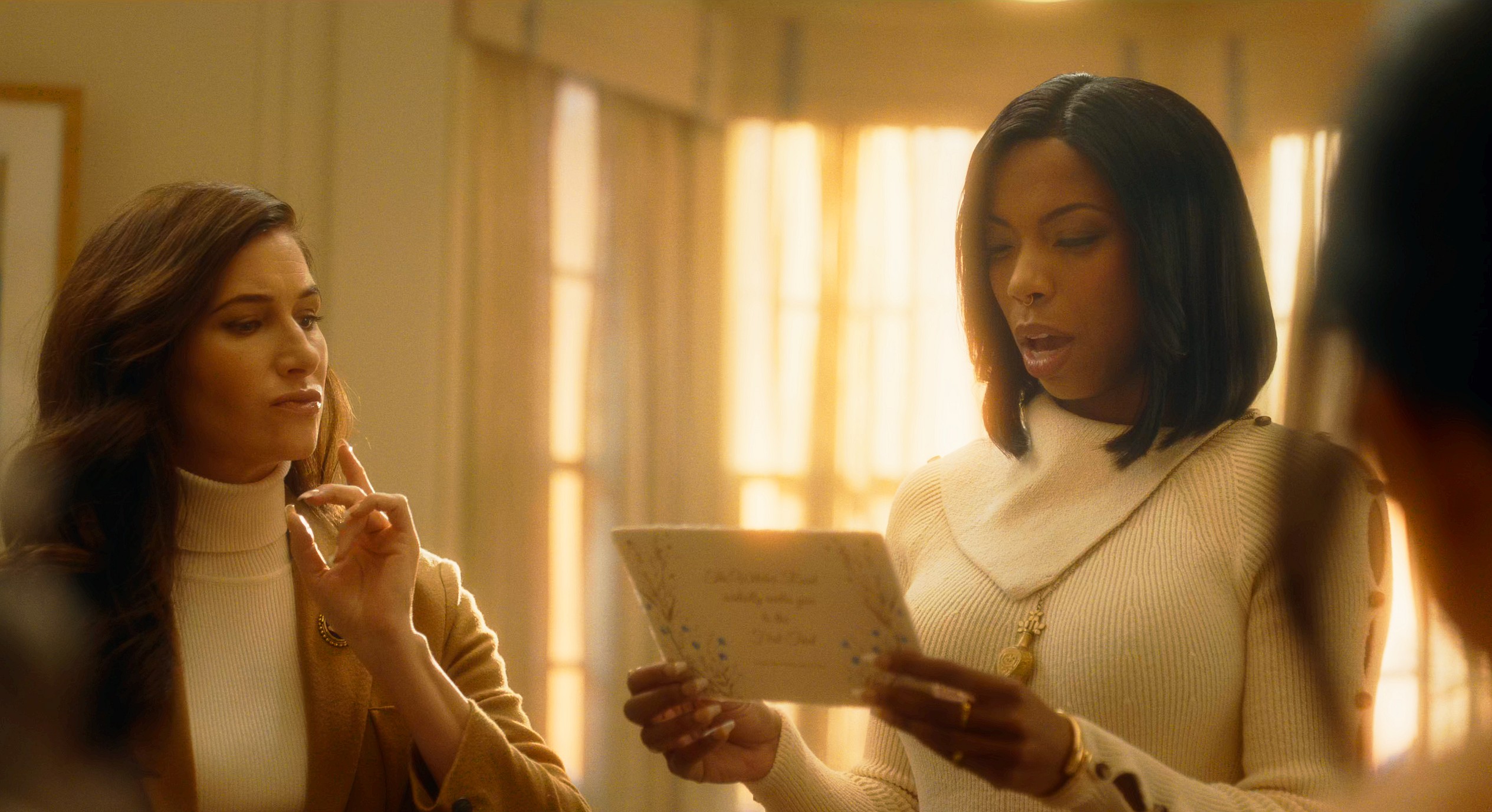 Agatha (Kathryn Hahn) and Jennifer Kale (Sasheer Zamata) receive the invitation to the First Trial of the Witches Road in Agatha All Along Season 1 Episode 3 "Through Many Miles/Of Tricks and Trials" (2024), Marvel Entertainment