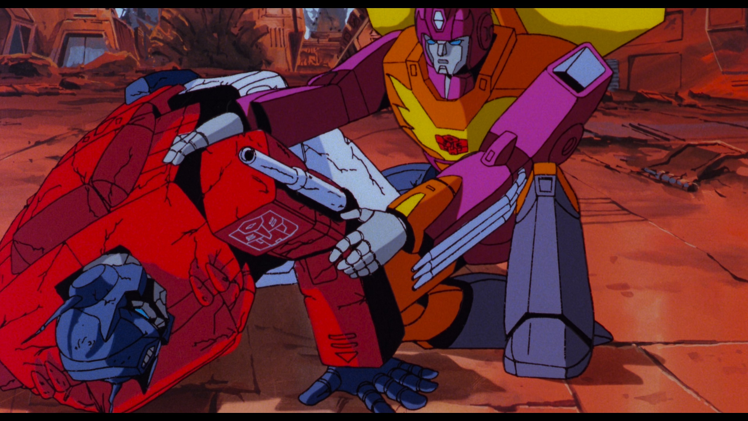 Hot Rod (Judd Nelson) rushes to the side of a wounded Optimus Prime (Peter Cullen) in The Transformers: The Movie (1986), Sunbow Productions