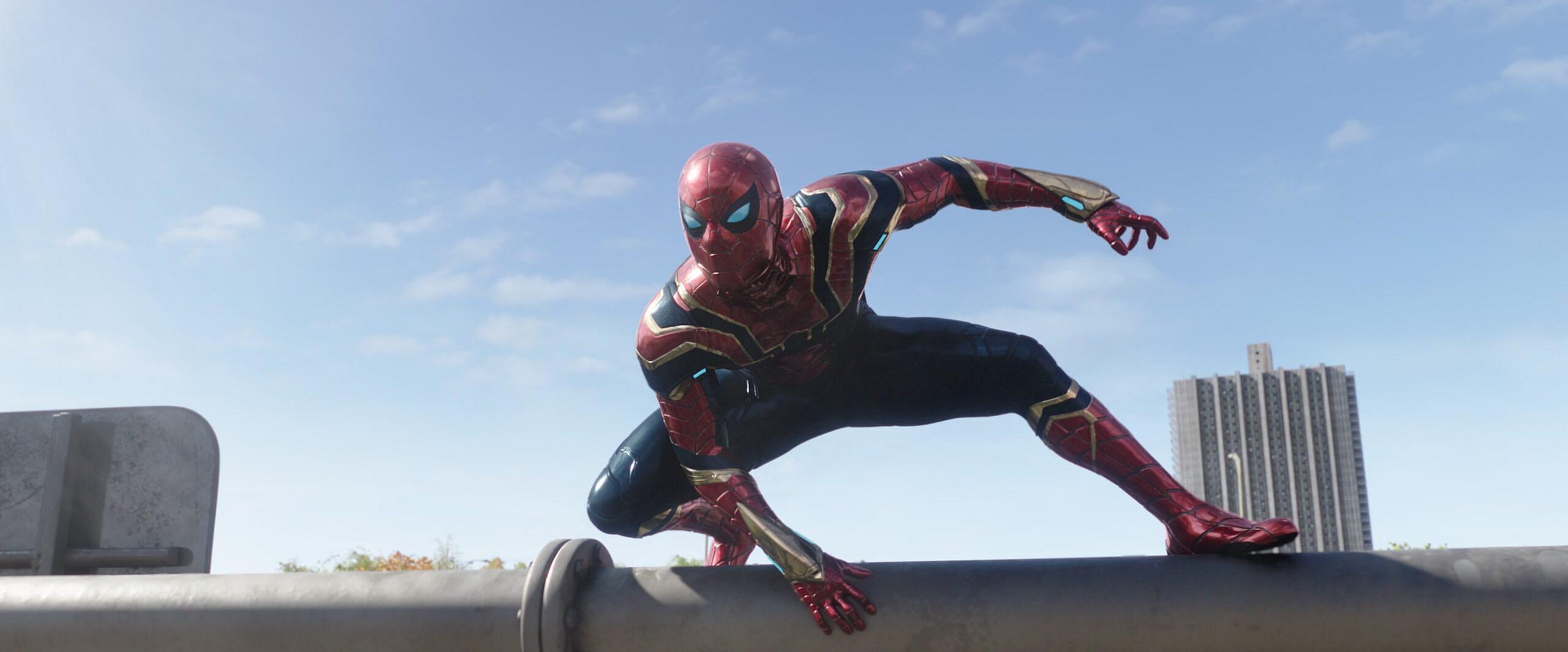 Spider-Man (Tom Holland) responds to super-villain attack reports in Spider-Man: No Way Home