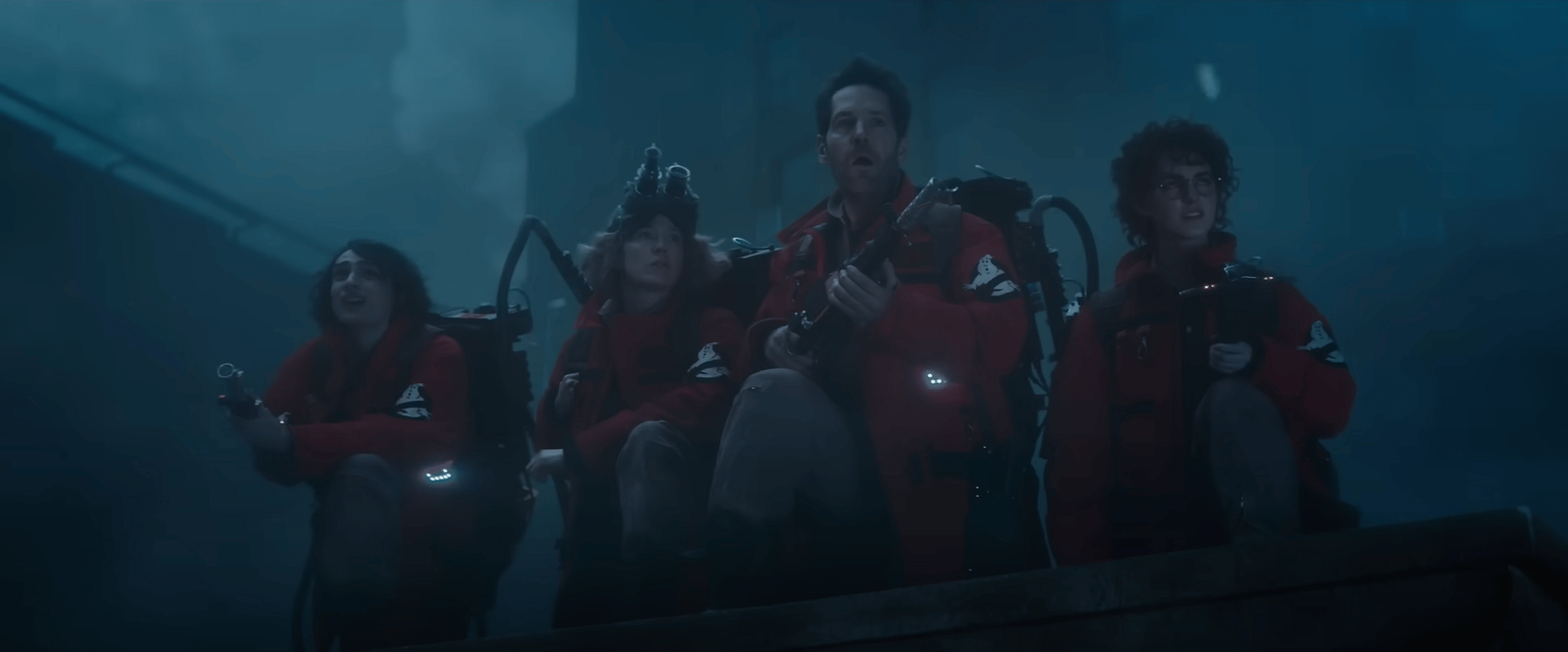 Finn Wolfhard as Trevor Spengler, Carrie Coon as Callie Spengler, Paul Rudd as Gary Grooberson, and Mckenna Grace as Phoebe Spengler in Ghostbusters: Frozen Empire (2024), Sony Pictures Entertainment