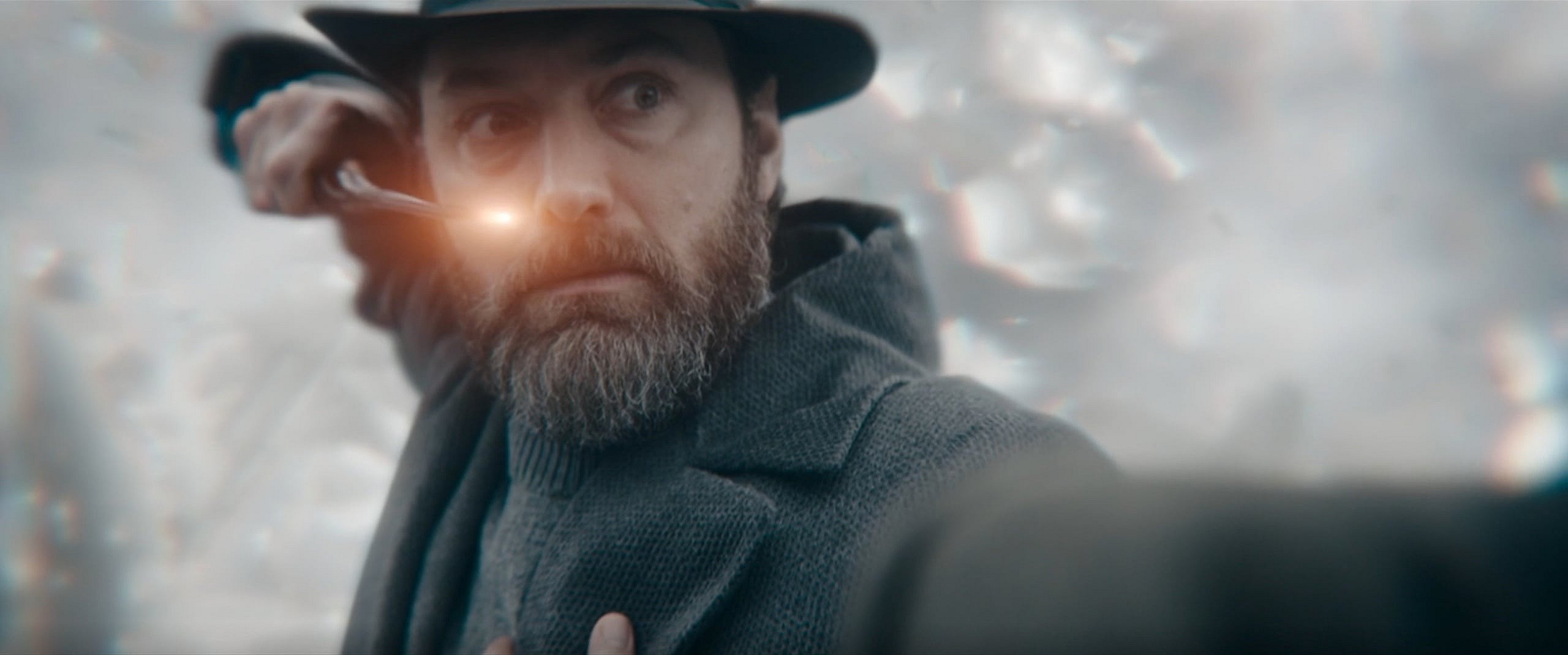 The blood pact between Albus Dumbledore (Jude Law) and Gellert Grindelwald (Mads Mikkelsen) is broken in Fantastic Beasts: The Secrets of Dumbledore (2022), Warner Bros. Pictures