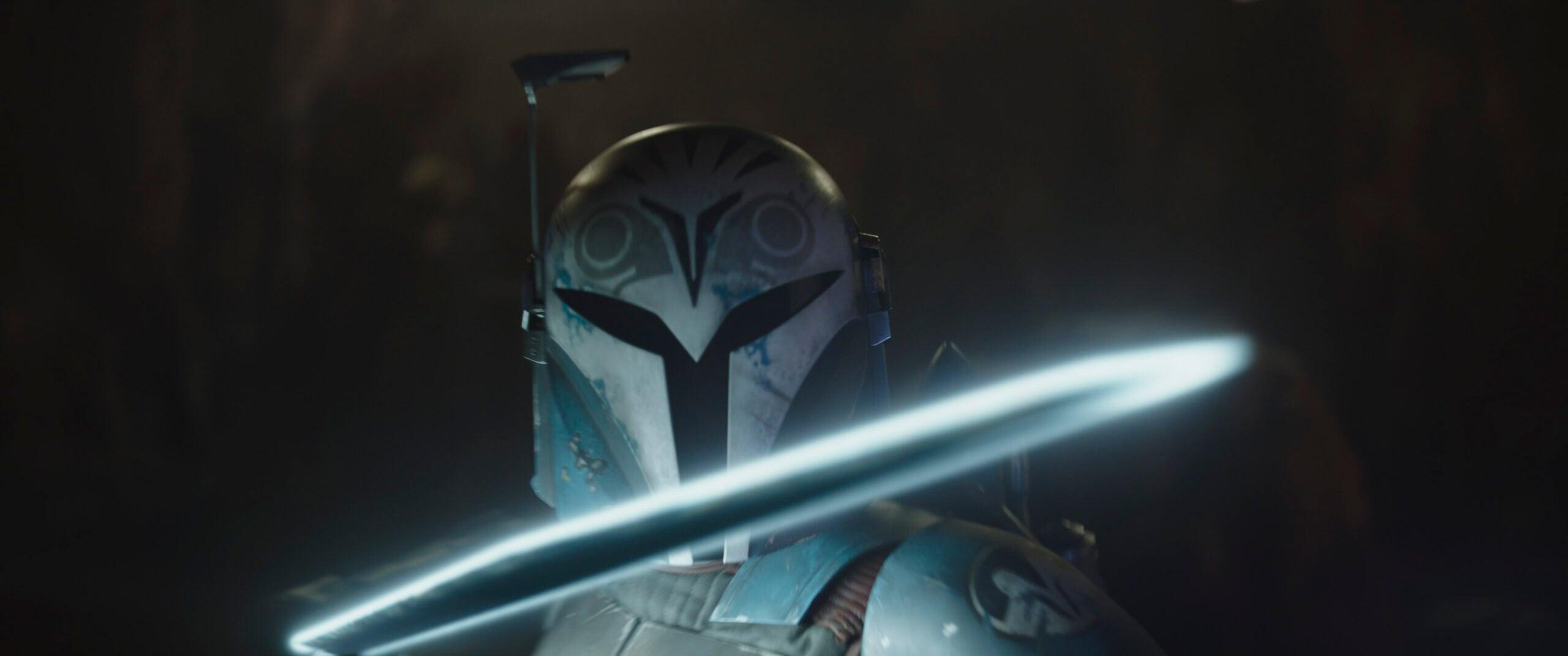 Bo-Katan Kryze (Katee Sackhoff) holding the Darksaber in a scene from Lucasfilm's THE MANDALORIAN, season three, exclusively on Disney+. ©2023 Lucasfilm Ltd. & TM. All Rights Reserved.