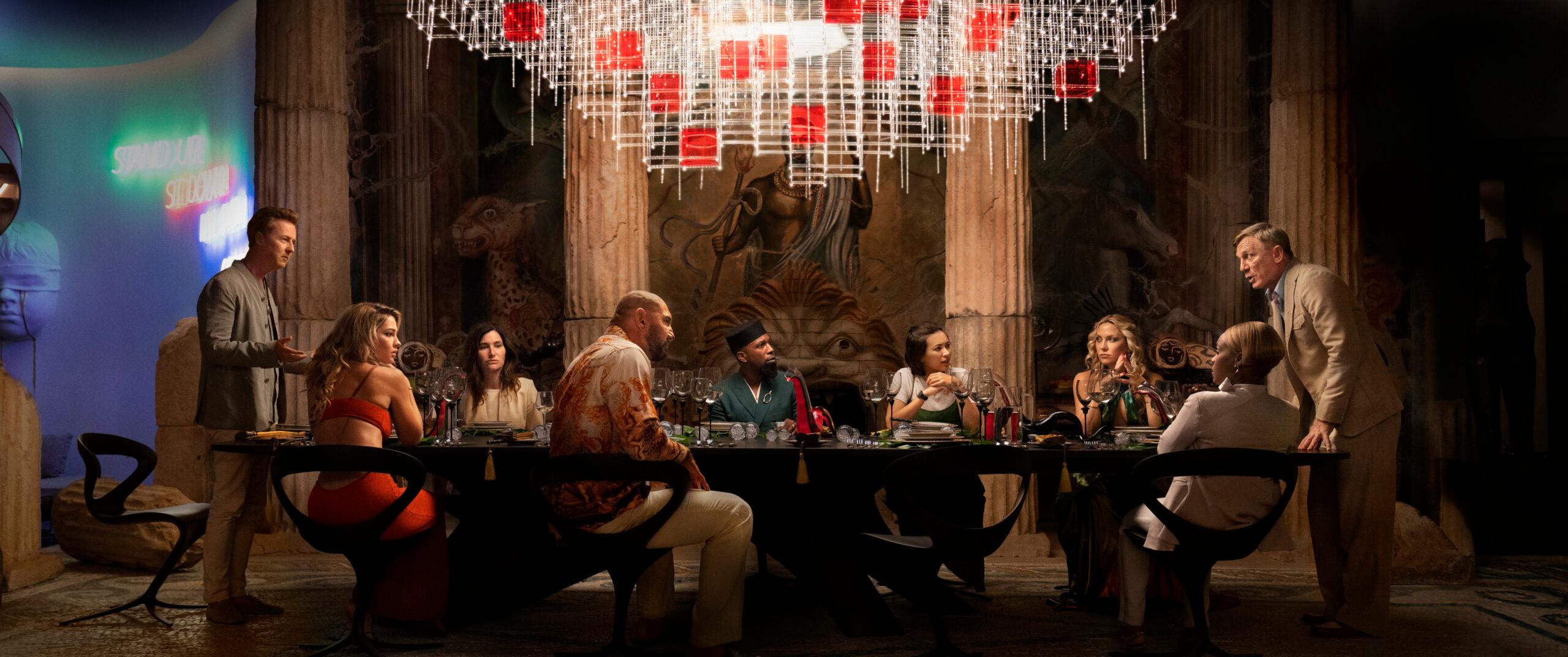 Glass Onion: A Knives Out Mystery (L-R) Edward Norton, Madelyn Cline, Kathryn Hahn, Dave Bautista, Leslie Odom Jr., Jessica Henwick, Kate Hudson, Janelle Monae, and Daniel Craig. Cr. John Wilson/Netflix © 2022.