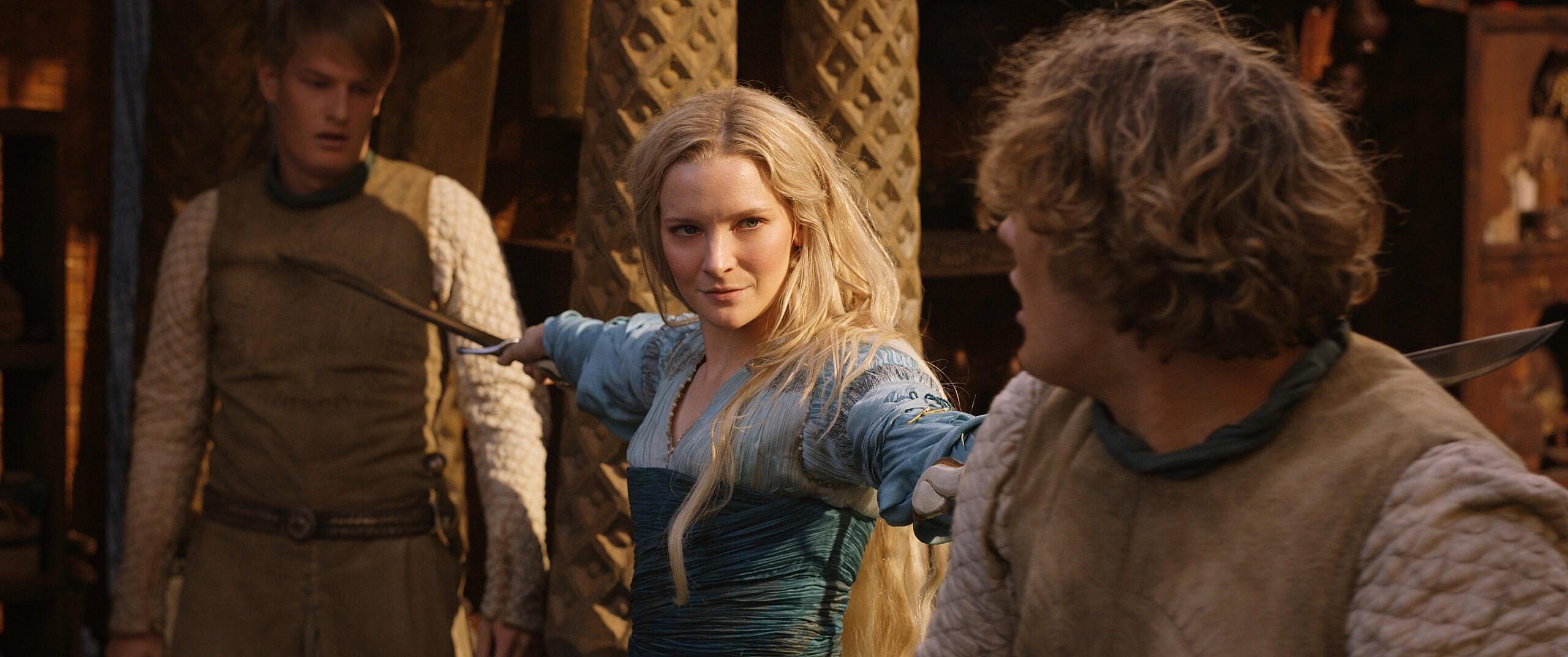 Galadriel draws her blades against two warriors in The Lord of the Rings: The Rings of Power Season