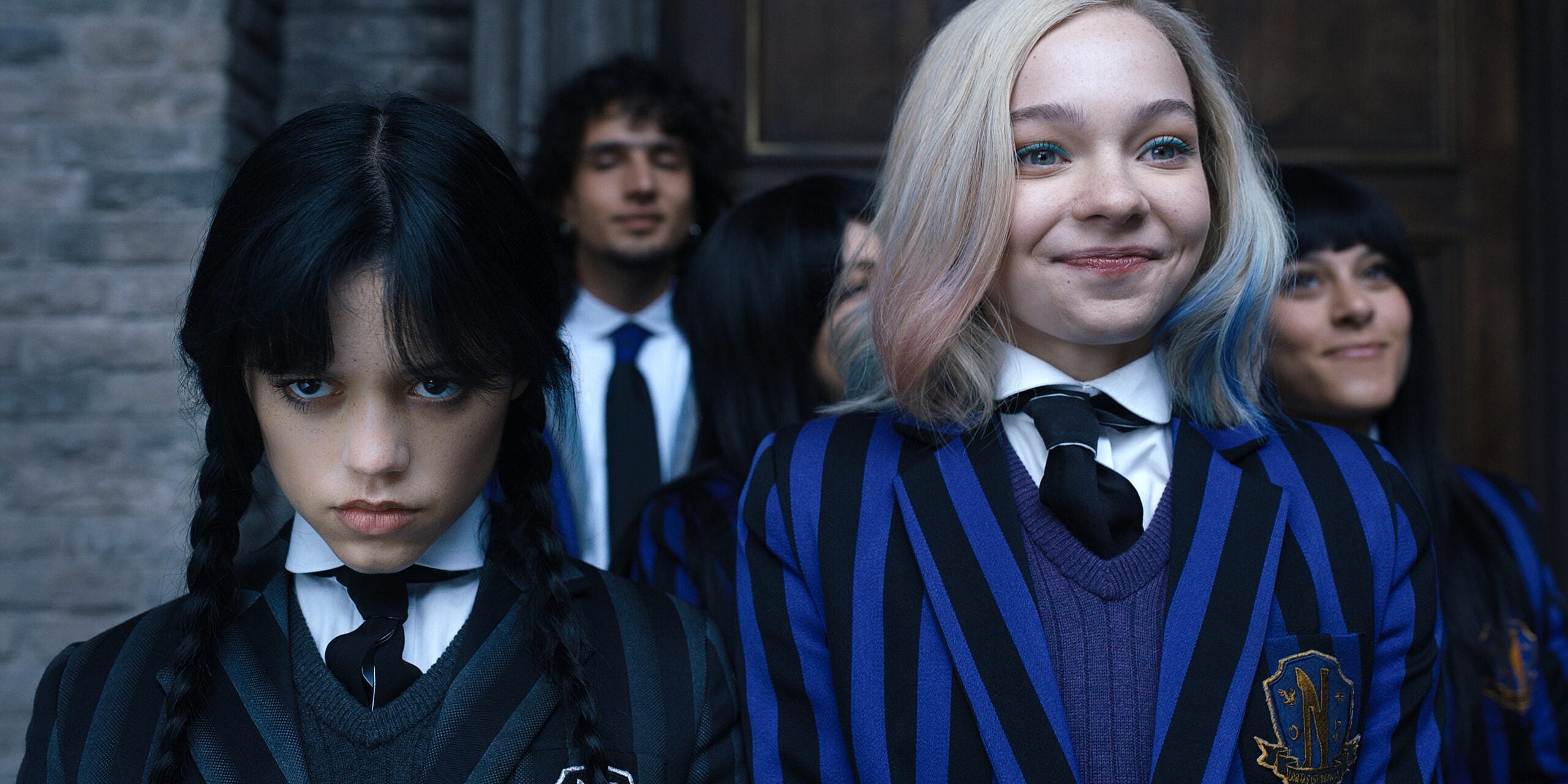 Wednesday. (L to R) Jenna Ortega as Wednesday Addams, Emma Myers as Enid Sinclair in episode 102 of Wednesday. Cr. Courtesy of Netflix © 2022