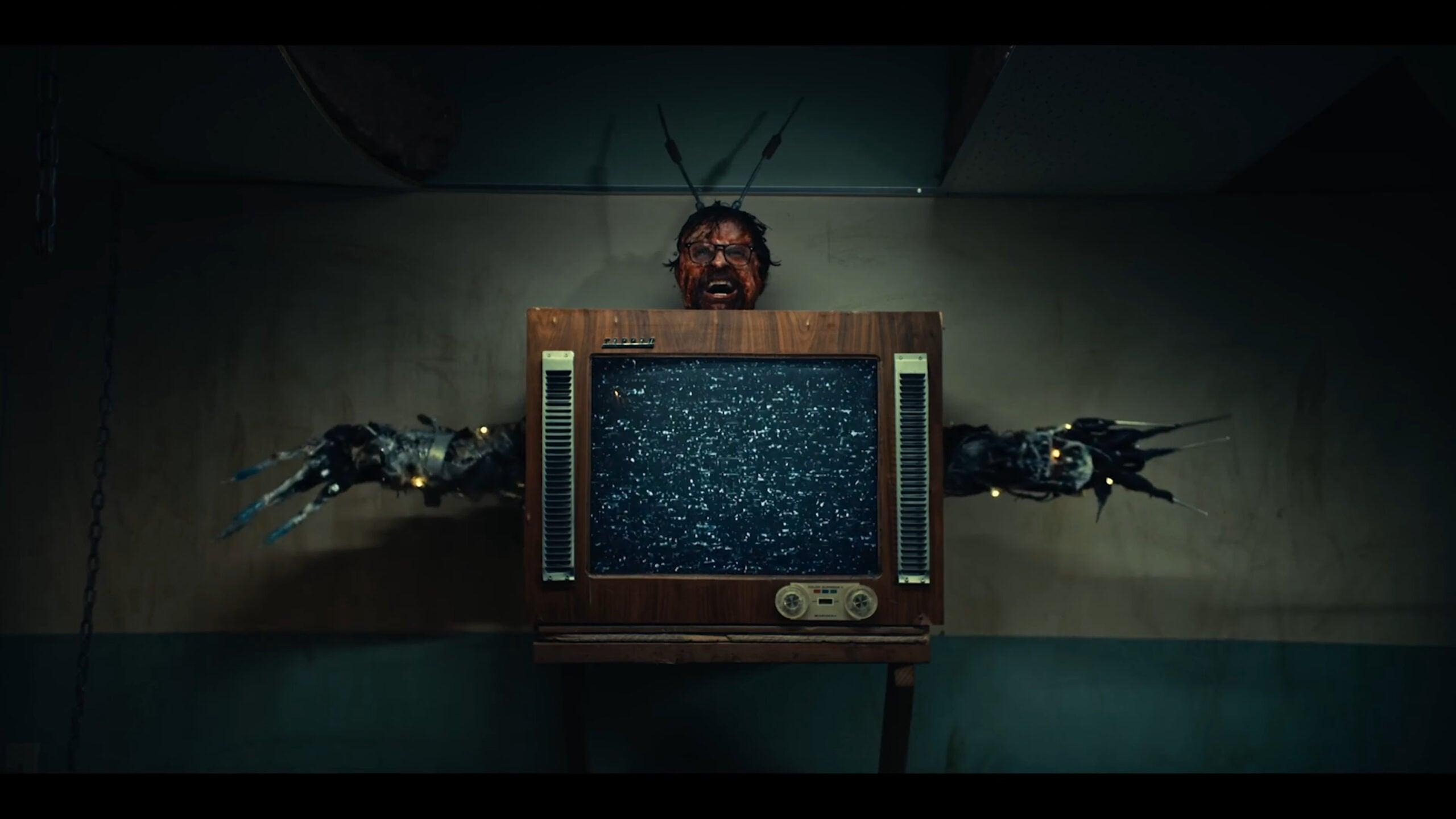 Sam (Byron Brown) goes a little bonkers in Scare Package II (2023), Shudder