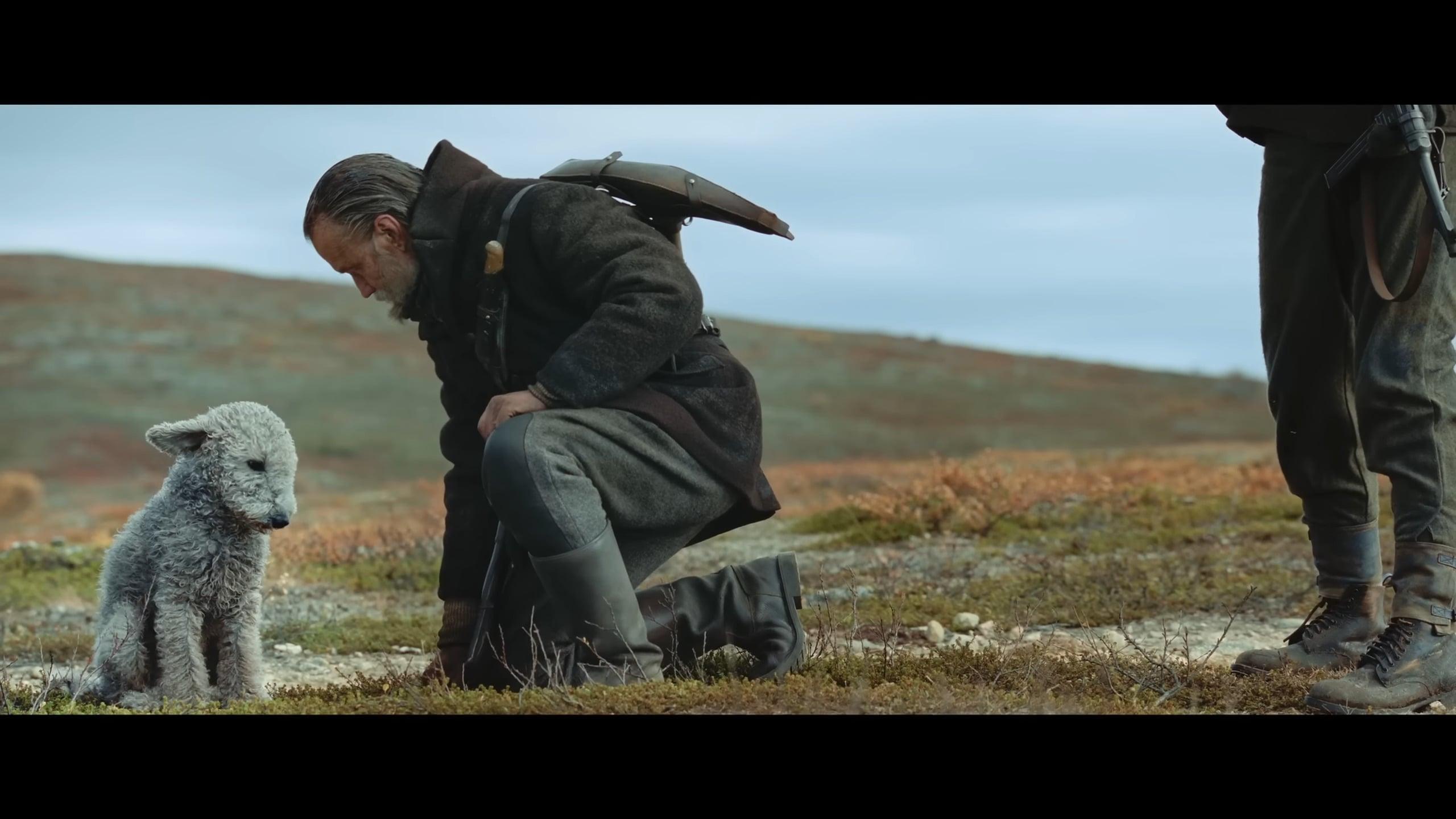 Aatami (Jorma Tommila) invites his dog to sit out the upcoming fight in Sisu (2023), Lionsgate