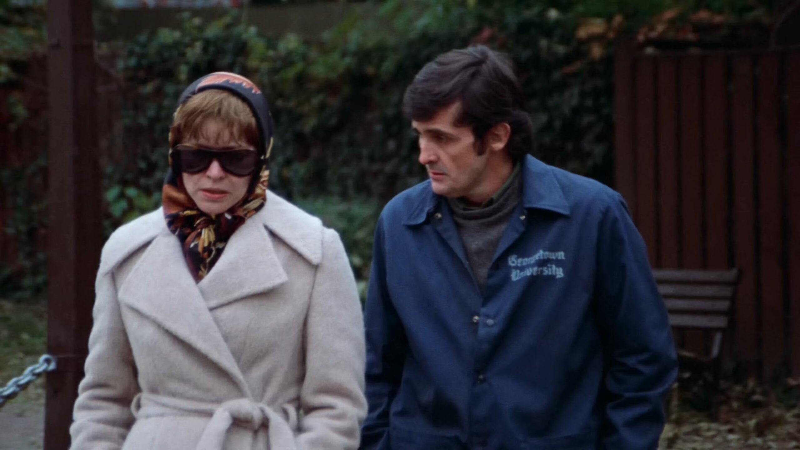 Chris MacNeil (Ellen Burstyn) turns to Father Damien Karras (Jason Miller) for help in The Exorcist (1973), Warner Bros. Pictures