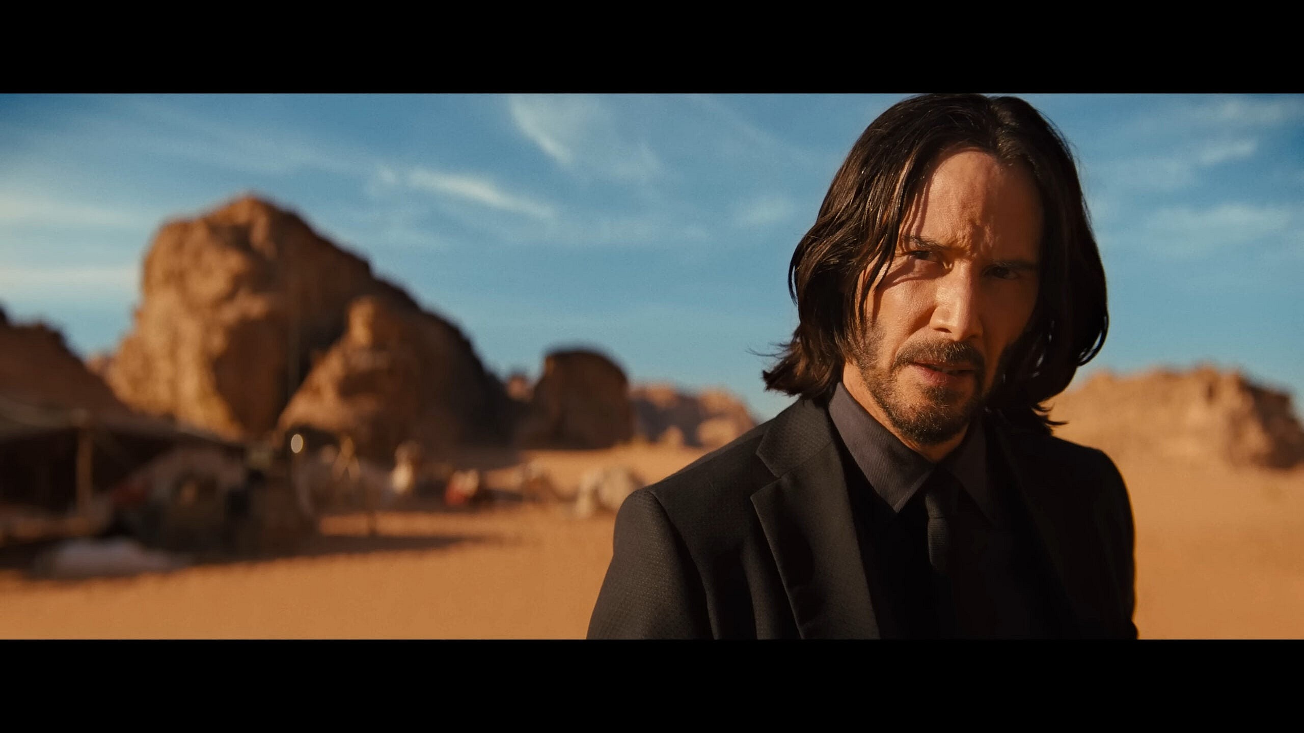 John Wick (Keanu Reeves) has a question for the Elder (George Georgiou) in John Wick: Chapter 4 (2023), Lionsgate Films