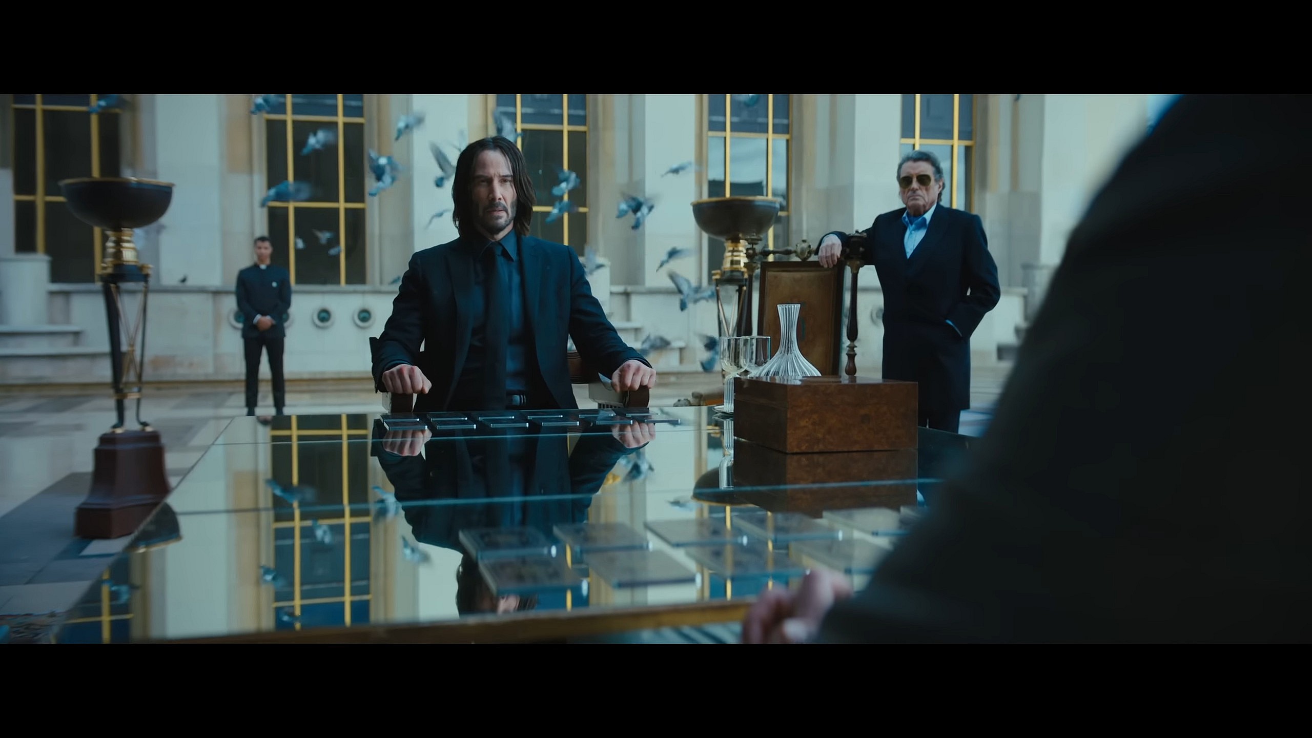 John Wick (Keanu Reeves) meets with Marquis Vincent de Gramont (Bill Skarsgård) in John Wick: Chapter 4 (2023), Lionsgate Films