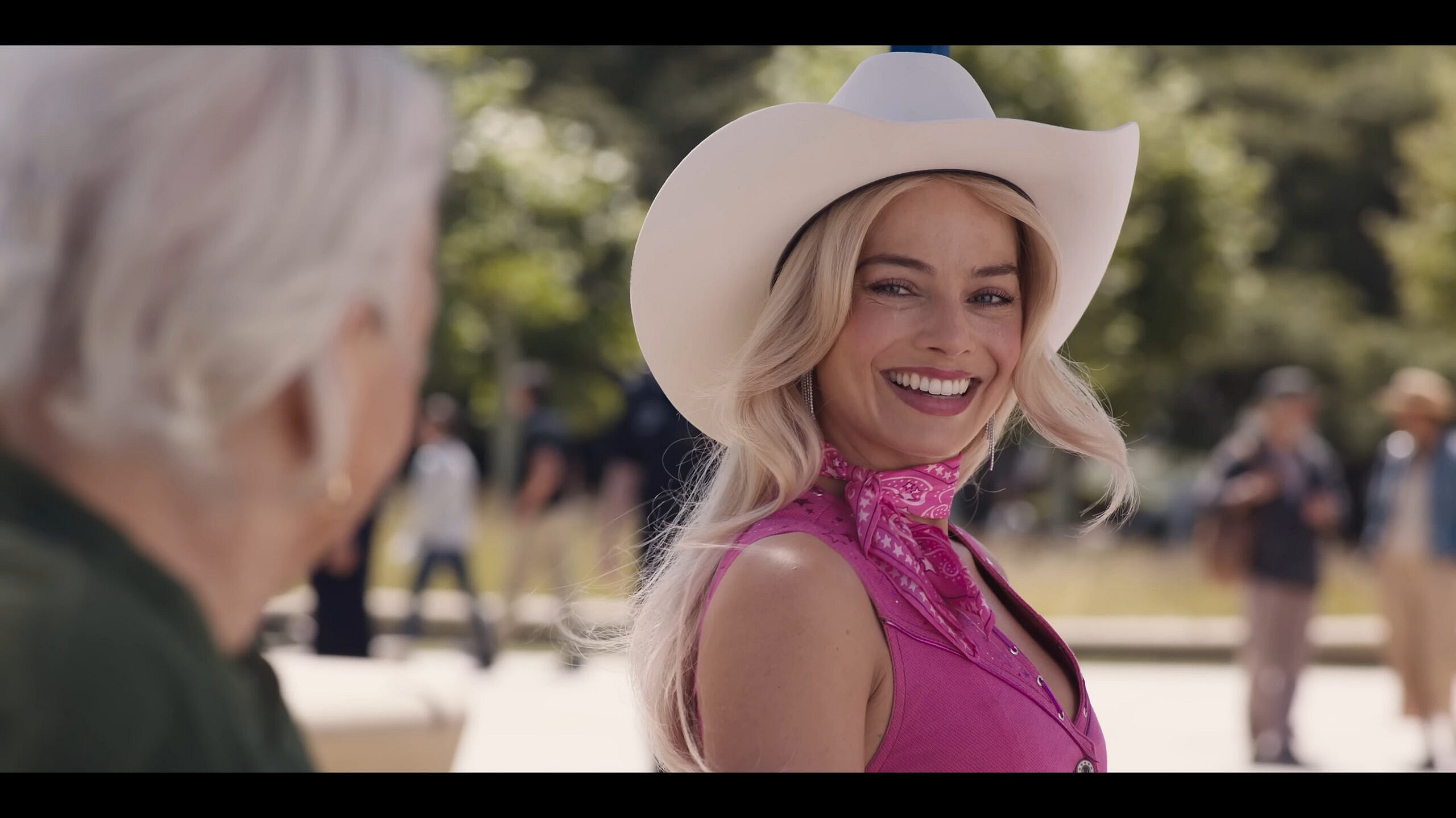 Barbie (Margot Robbie) does her best to keep her chin up in Barbie (2023), Warner Bros. Pictures
