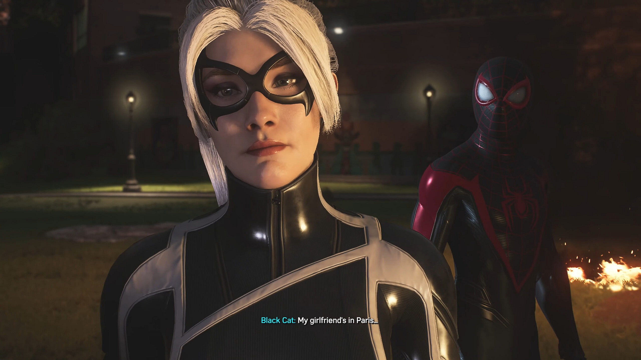 Black Cat (Eric Lindbeck) brushes off Miles Morales' (Nadji Jeter) concerns in Marvel's Spider-Man 2 (2023), Insomniac Games