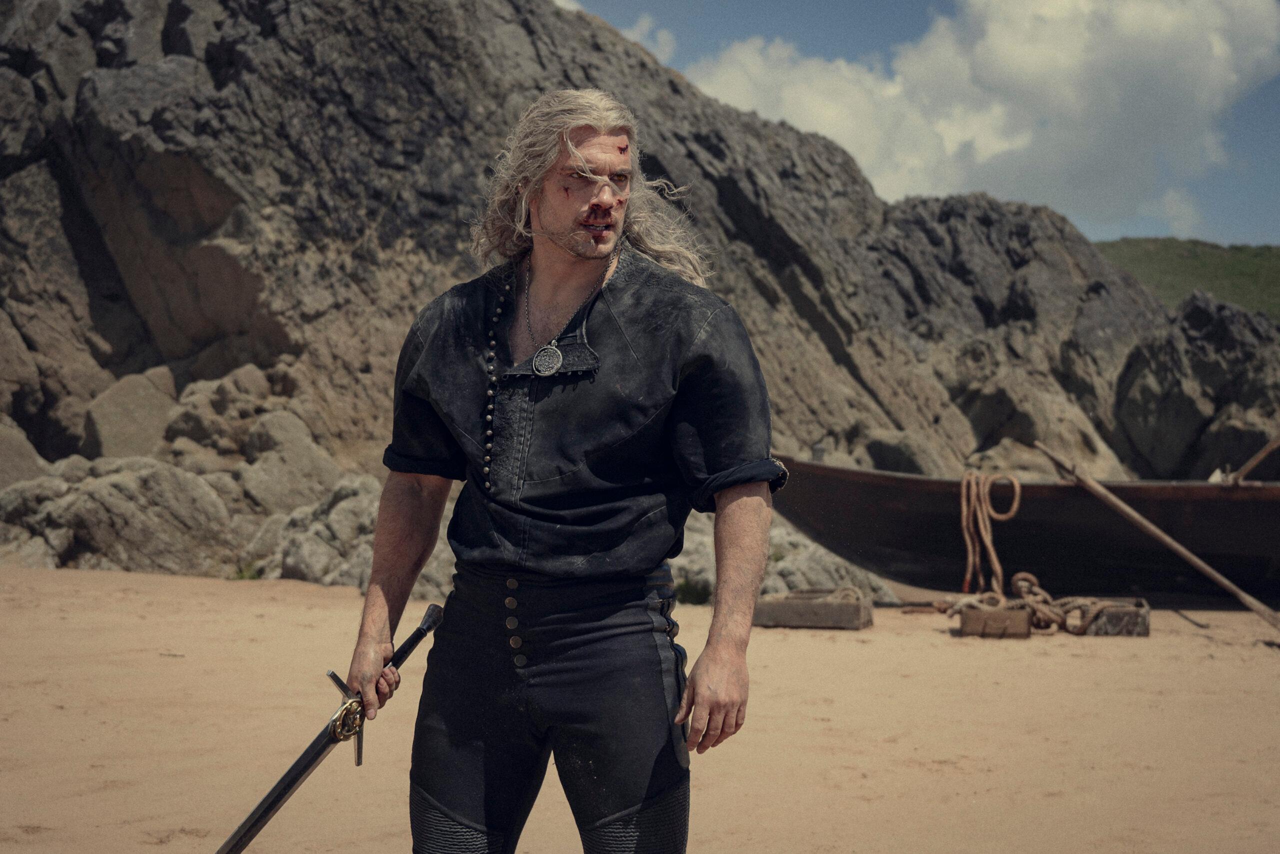 A bloodied Geralt (Henry Cavill) stands in defense of Ciri (Frteya Allan) in The Witcher Season 3 Episode 6 "Everybody Has a Plan 'Til They Get Punched in the Face" (2023), Netflix
