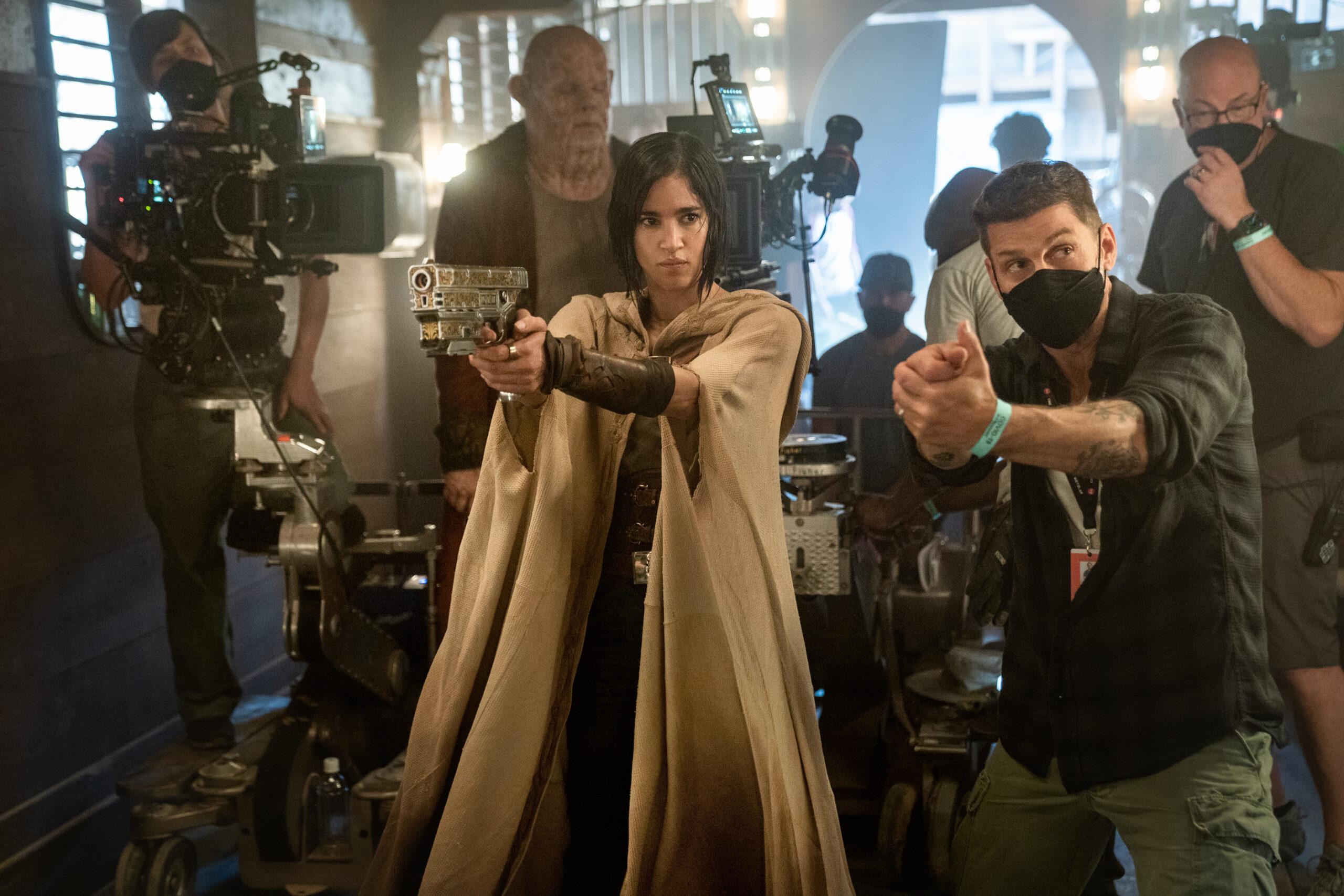 REBEL MOON: (Featured L-R) Sofia Boutella as Kora and Director/writer/producer Zack Snyder on the set of Rebel Moon. Cr. Clay Enos/Netflix © 2023