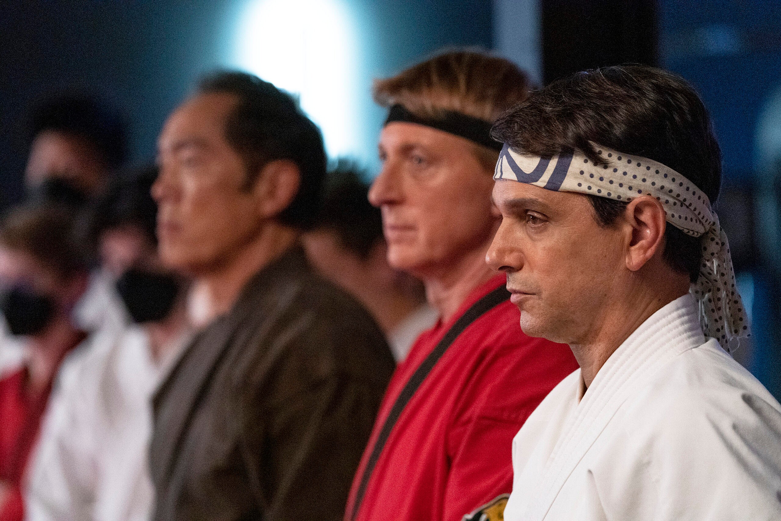 Cobra Kai. (L to R) Yuji Okumoto as Chozen Toguchi, William Zabka as Johnny Lawrence, Ralph Macchio as Daniel LaRusso in episode 508 of Cobra Kai. Cr. Curtis Bonds Baker/Netflix © 2022