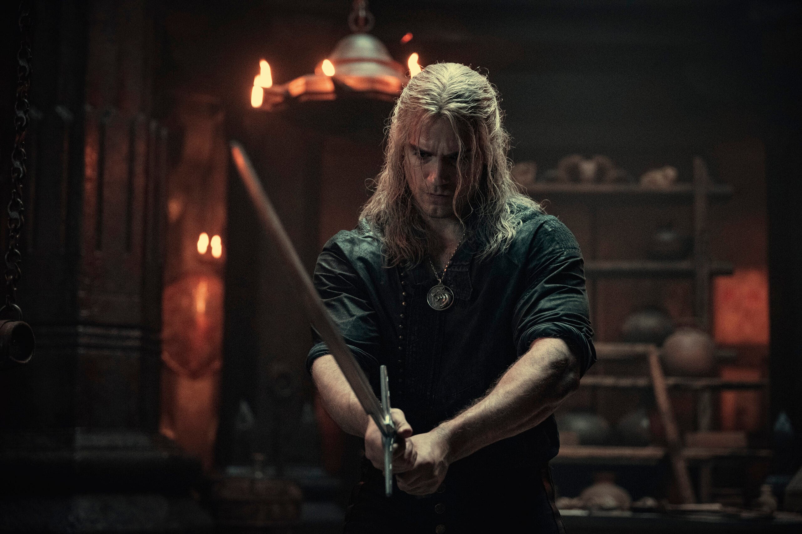 Geralt (Henry Cavill) takes up his blade in The Witcher Season 2 Episode 5 “Turn Your Back” (2021) via Netflix
