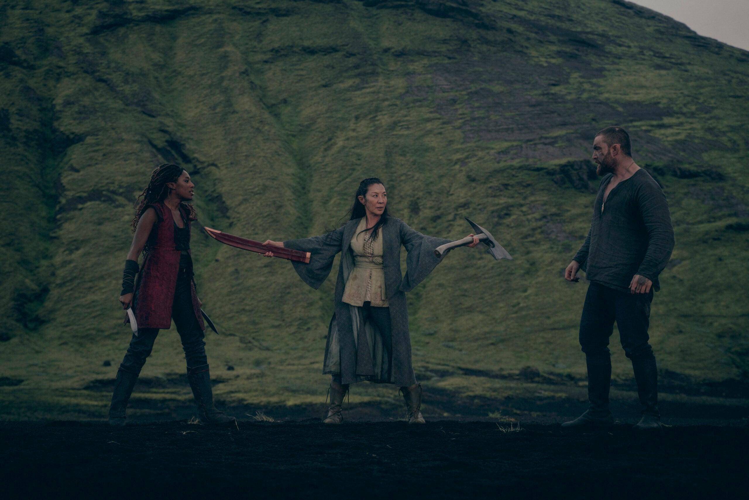 Sophia Brown as Éile, Michelle Yeoh as Scia, and Laurence O’Fuarain as Fjall in The Witcher: Blood Origin (2022) via Netflix