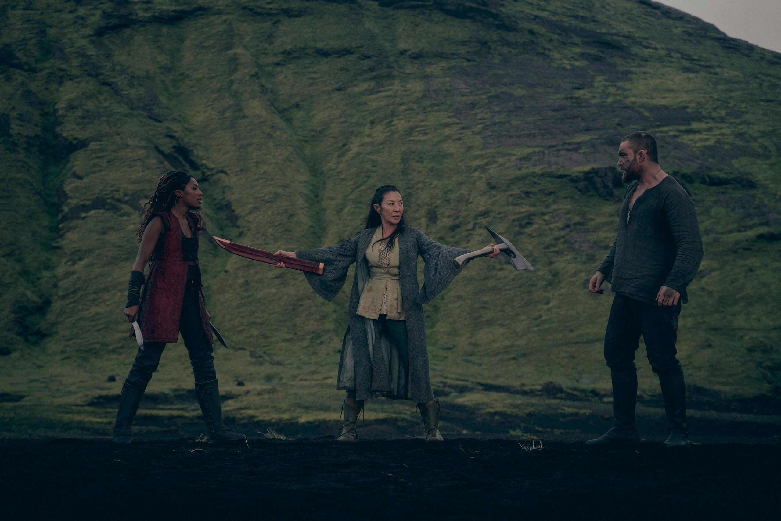Sophia Brown as Éile, Michelle Yeoh as Scia, Laurence O'Fuarain as Fjall in The Witcher: Blood