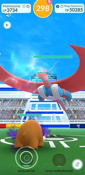 A Mamoswine faces off against a giant Mega Salamence in a Raid Battle via Pokémon GO (2016), Niantic