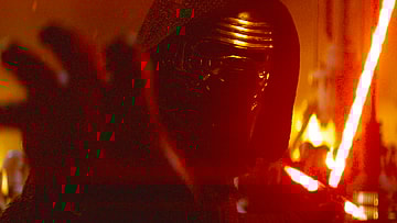 Kylo Ren (Adam Driver) uses the Force to grab a plasma bolt fired at him by Poe (Oscar Isaac) in Star Wars Episode VII - The Force Awakens (2015), Lucasfilm