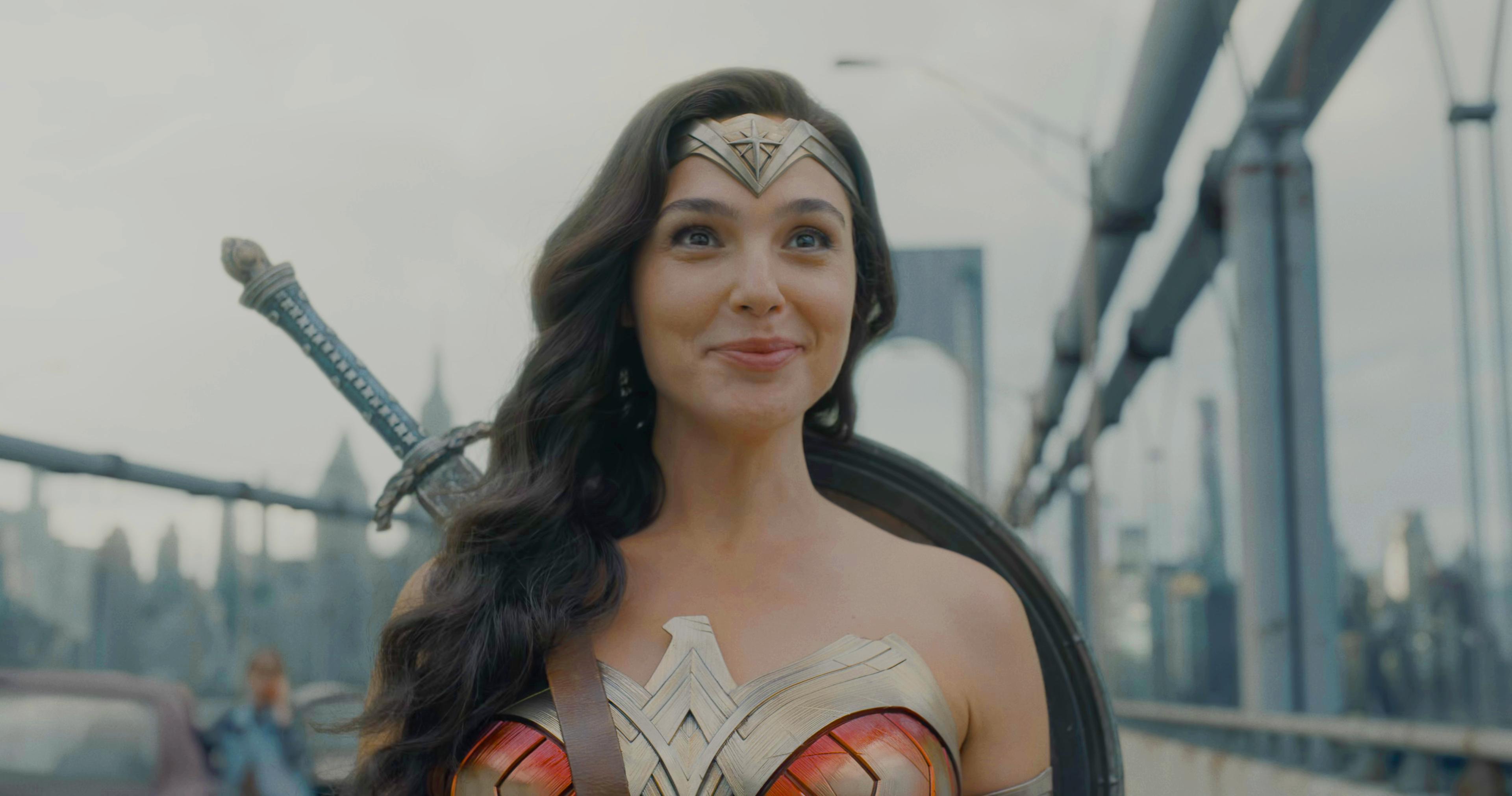 Wonder Woman (Gal Gadot) flashes a smile after sitting through a spot of Marvel humor in The Flash (2023), Warner Bros. Discovery