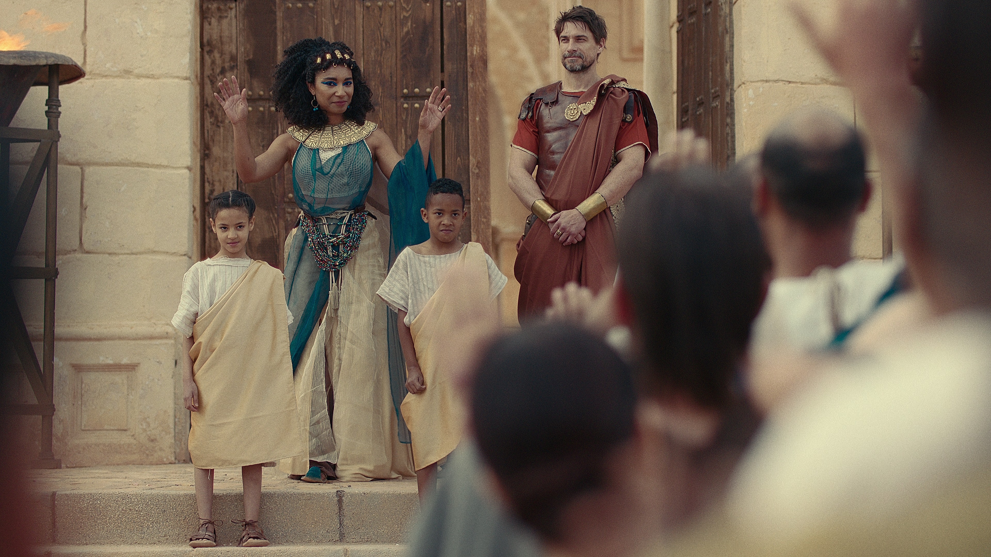Cleopatra (Adele James) and Mark Antony (Craig Russell) introduce their children in Queen Cleopatra (2023), Netflix