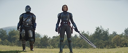 (L-R): Din Djarin (Pedro Pascal) and Bo-Katan Kryze (Katee Sackhoff) with the Darksaber in Lucasfilm's THE MANDALORIAN, season three, exclusively on Disney+. ©2023 Lucasfilm Ltd. & TM. All Rights Reserved.
