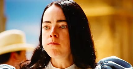 Bella (Emma Stone) contemplates more in Poor Things (2023), Searchlight Pictures