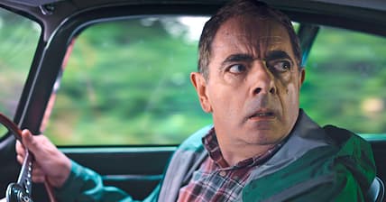 A desperate Trevor Bingley (Rowan Atkinson) rushes to the veterinary in Man vs. Bee Season 1 Episode 8 "Chapter 8" (2022), Netflix